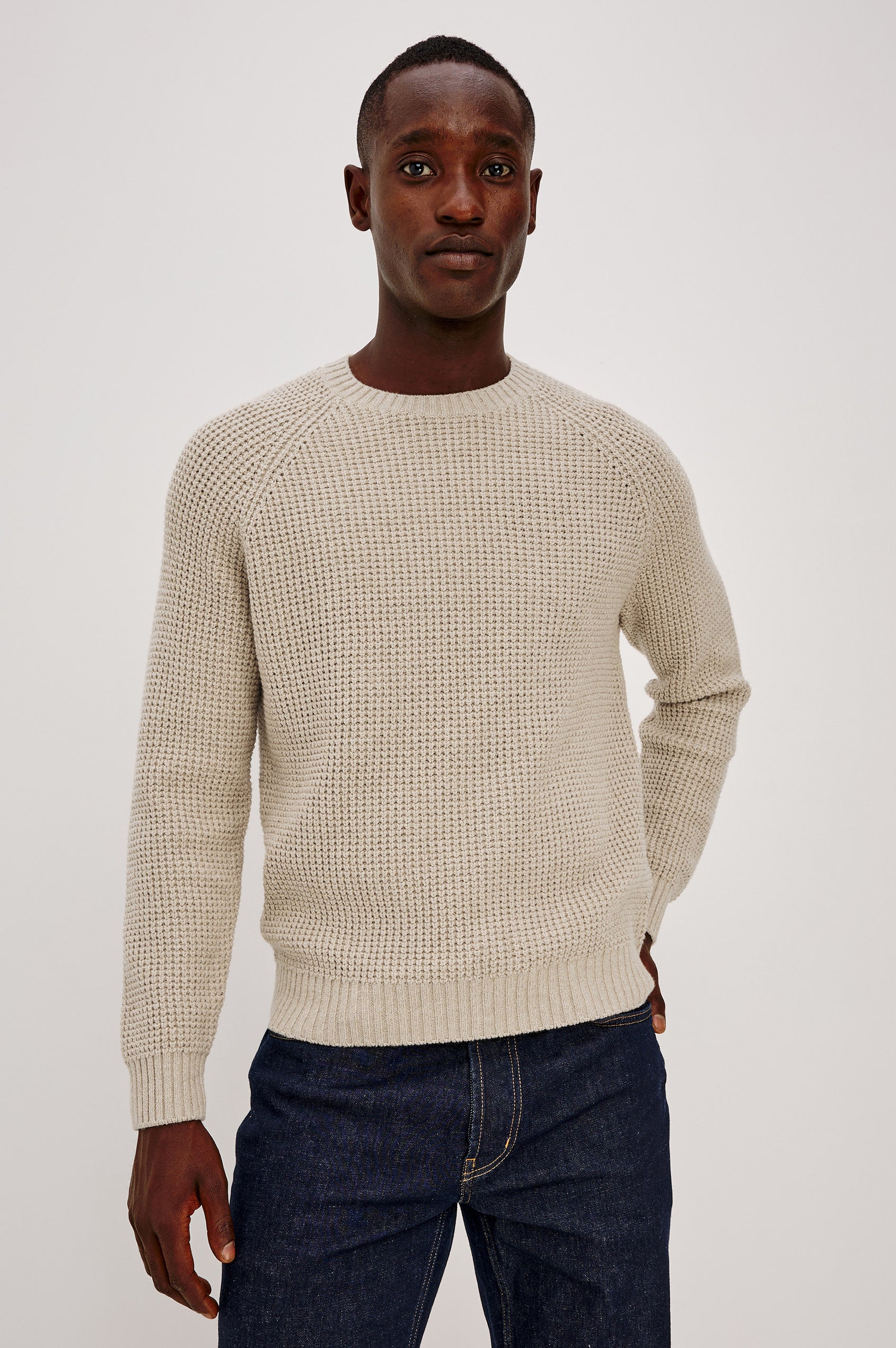 Augustus Sweater in Midweight Cotton-Linen Knit With Thermal Stitch, Textured Bouclé Finish, Raglan Long Sleeves, and Ribbed Trim in Vellum Colorway - Upper Body Front View Featured on Model