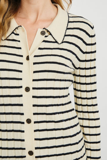 Aurelia Long-Sleeve, Wide Ribbed Top with Buttons Down the Front, a Collar and  Scalloped Stitching at the Collar and Cuffs in Ivory Navy Stripe Colorway - Horizontal Stripes - Front View Featured on Model 