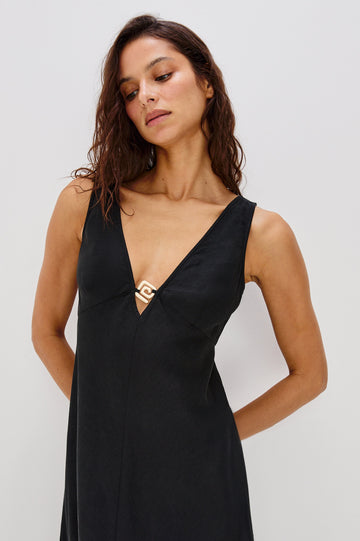 Avila V-Neck, A-Line Tank Dress, Midi Length with Spiral Metal Hardware at Center Front Bust in Black Colorway. Front View Shown on Model.