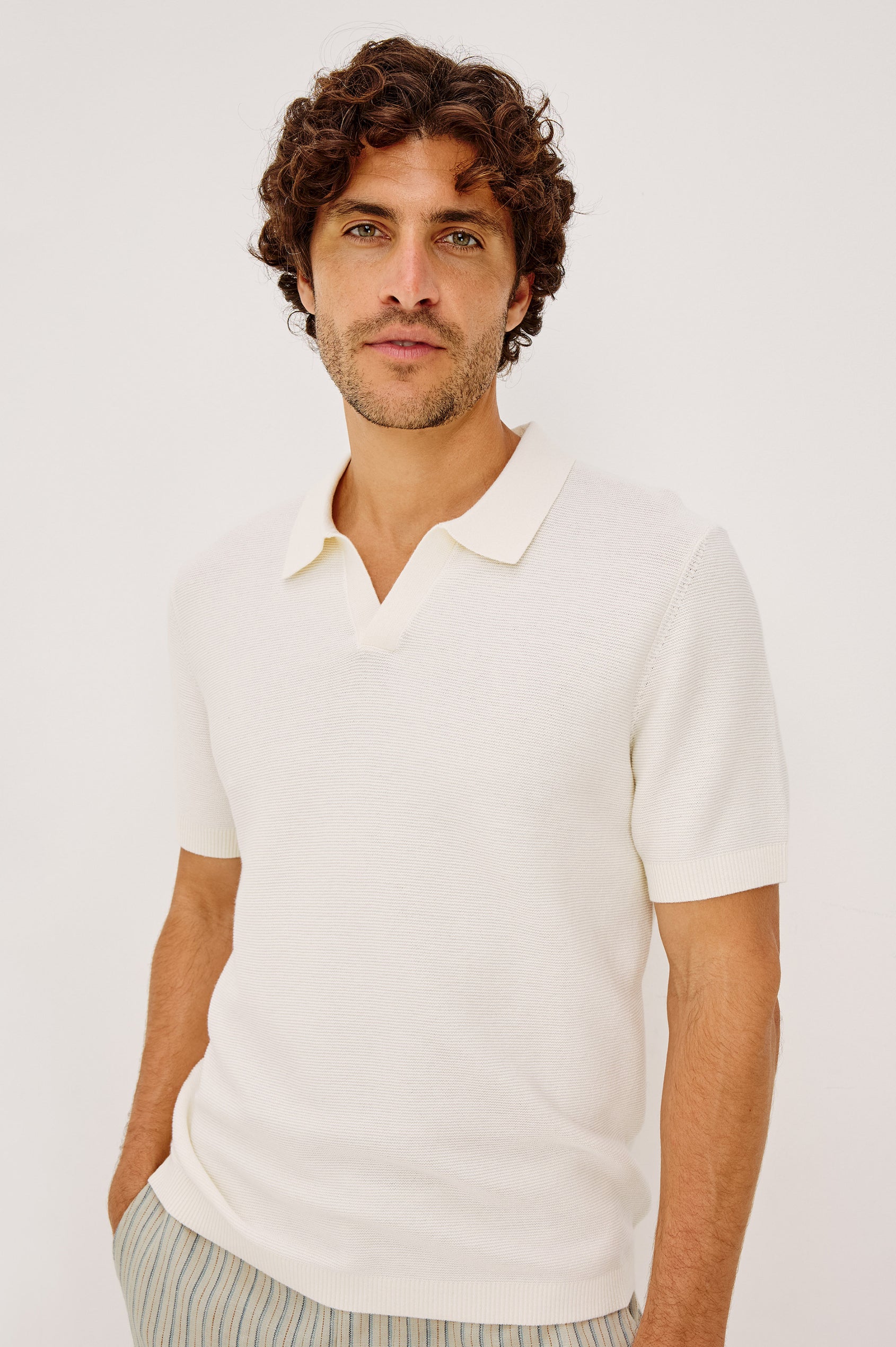 Baker Polo Shirt in Rib Cotton Knit With Colar, Short Sleeves, and Relaxed Fit in Ivory Colorway - Upper Body Front View Featured on Model