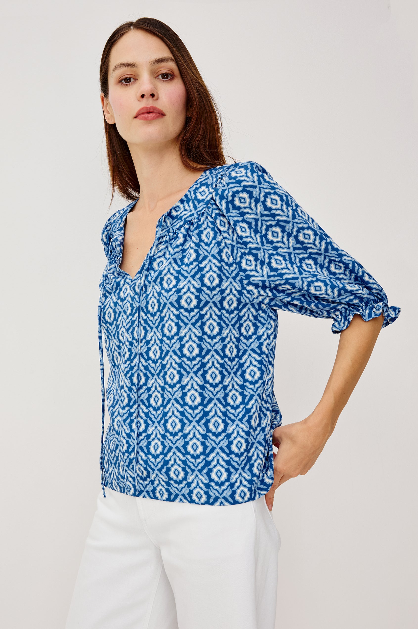 Belina Top With Gathrered V-Neck With Self-Ties Elbow Length Sleeves in Blue Ikat Colorway - Upper Body Front View Featured on Model