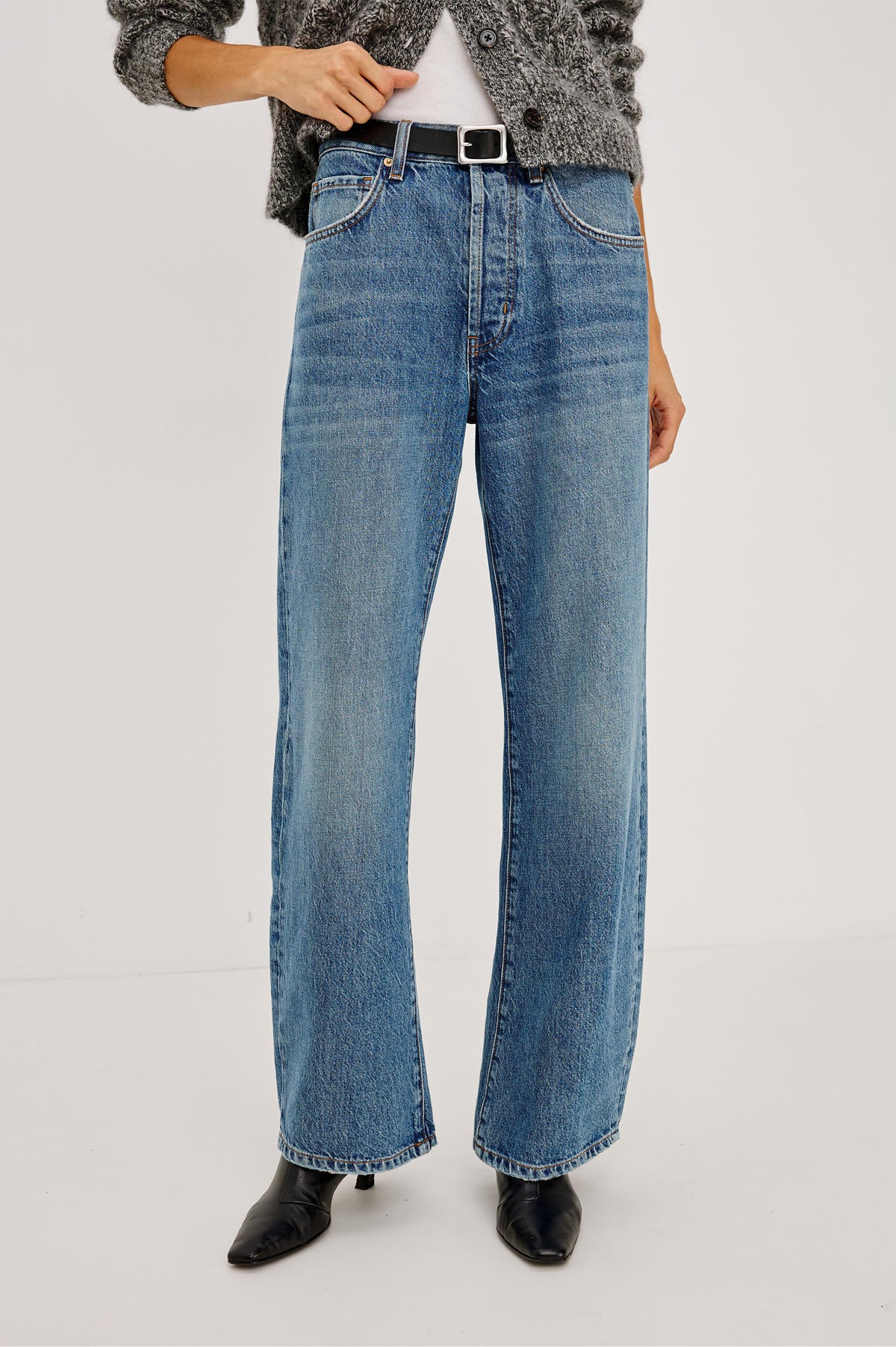 Belmont Arc Leg Jean in Rigid Denim With High Rise, Distressed Detailing, Button Fly, and 5-Pockets in Homestead Colorway - Front View Featured on Model