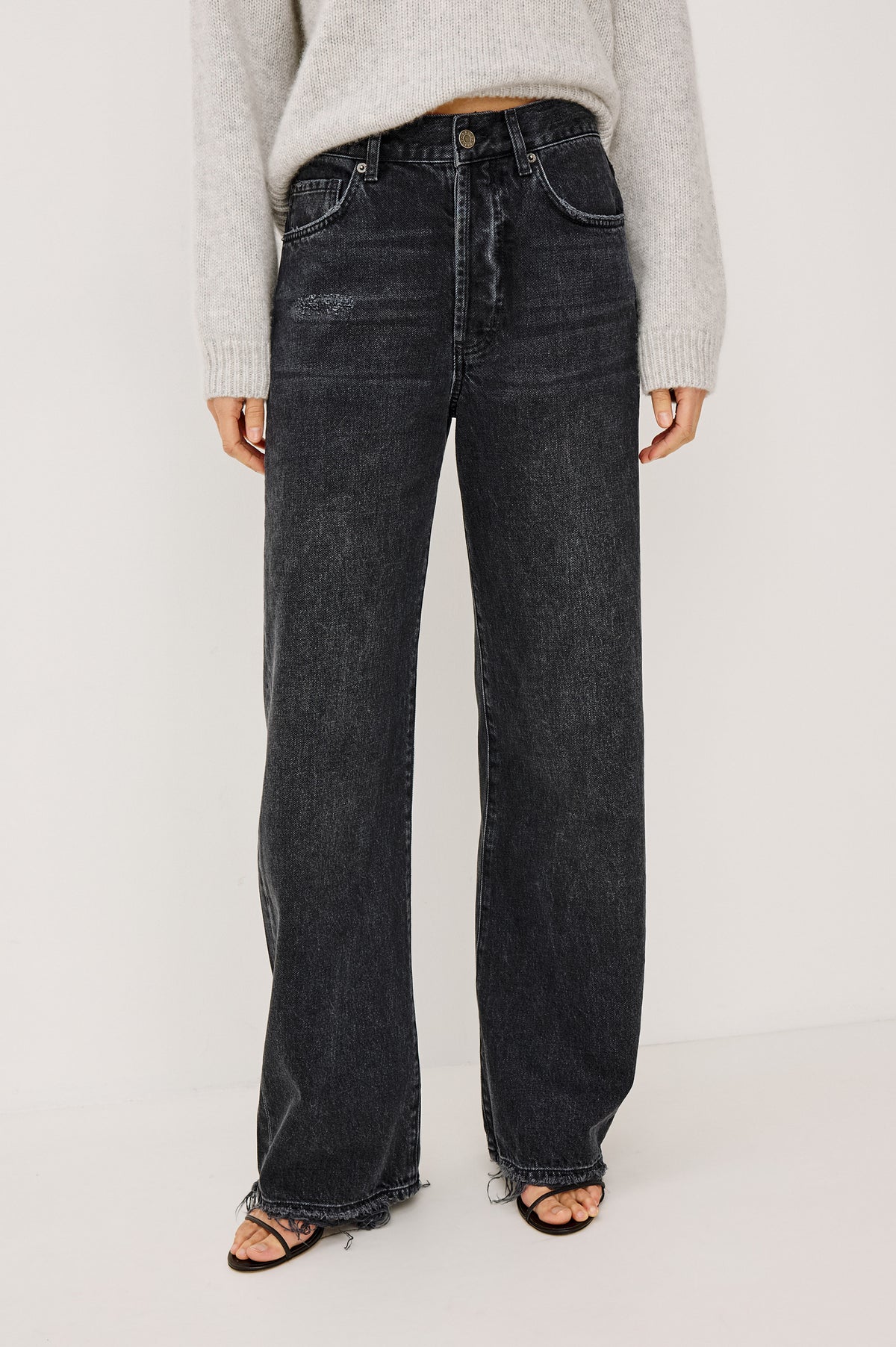 Belmont Arc Leg Jean in Rigid Denim With High Rise, Distressed Detailing, Button Fly, and 5-Pockets in Night Cap Colorway - Lower Body Front View Featured on Model