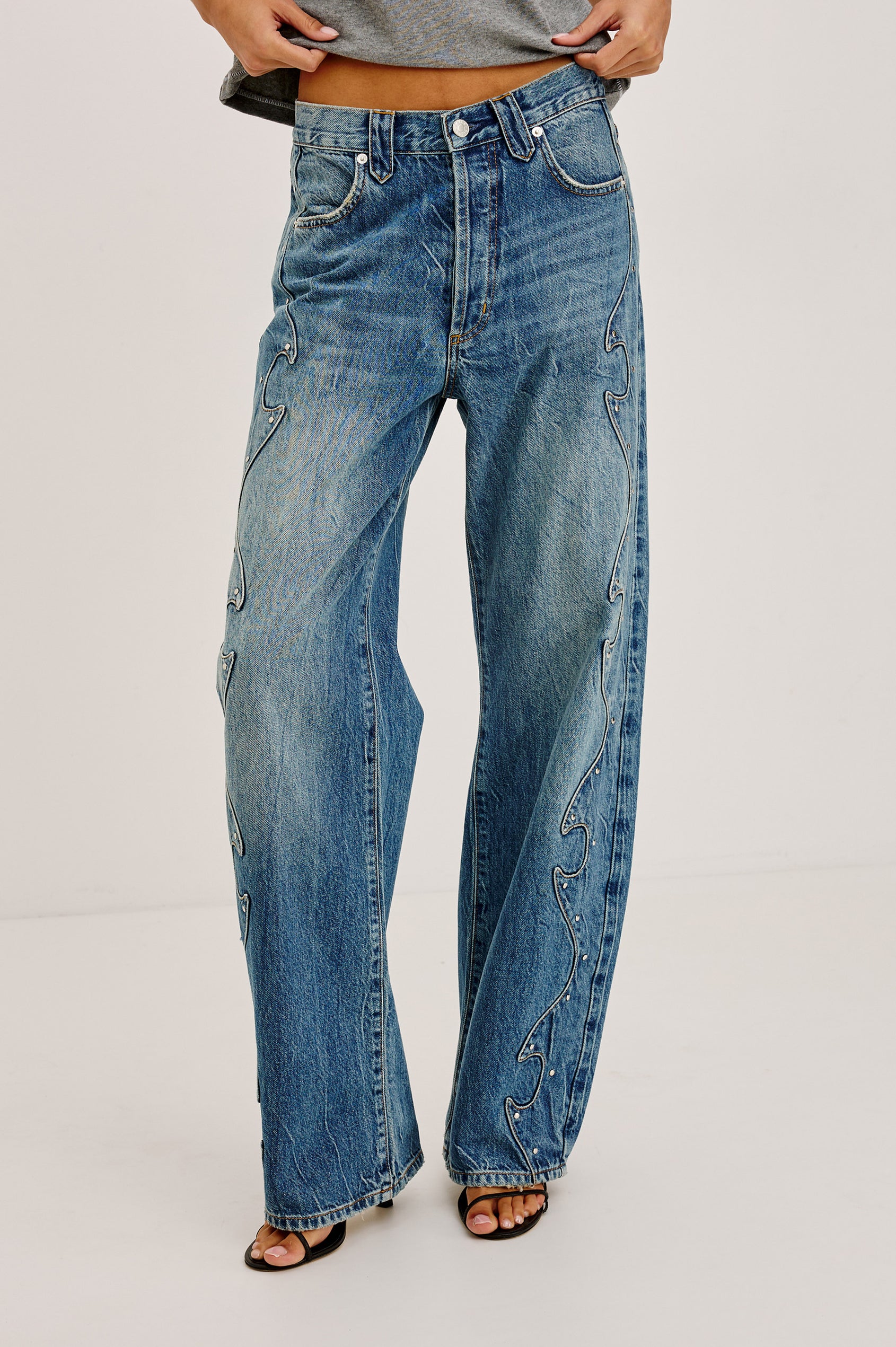 Belmont Arc Leg Jean in Rigid Denim With High Rise, Western Side Seam and Stud Detailing, Button Fly, and Side and Back Pockets in Night Cap Colorway - Lower Body Front View Featured on Model