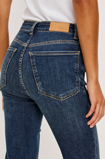 Bixby is a 5-pkt slim straight jean in Deep Dive colorway. Close up back view featured on model.