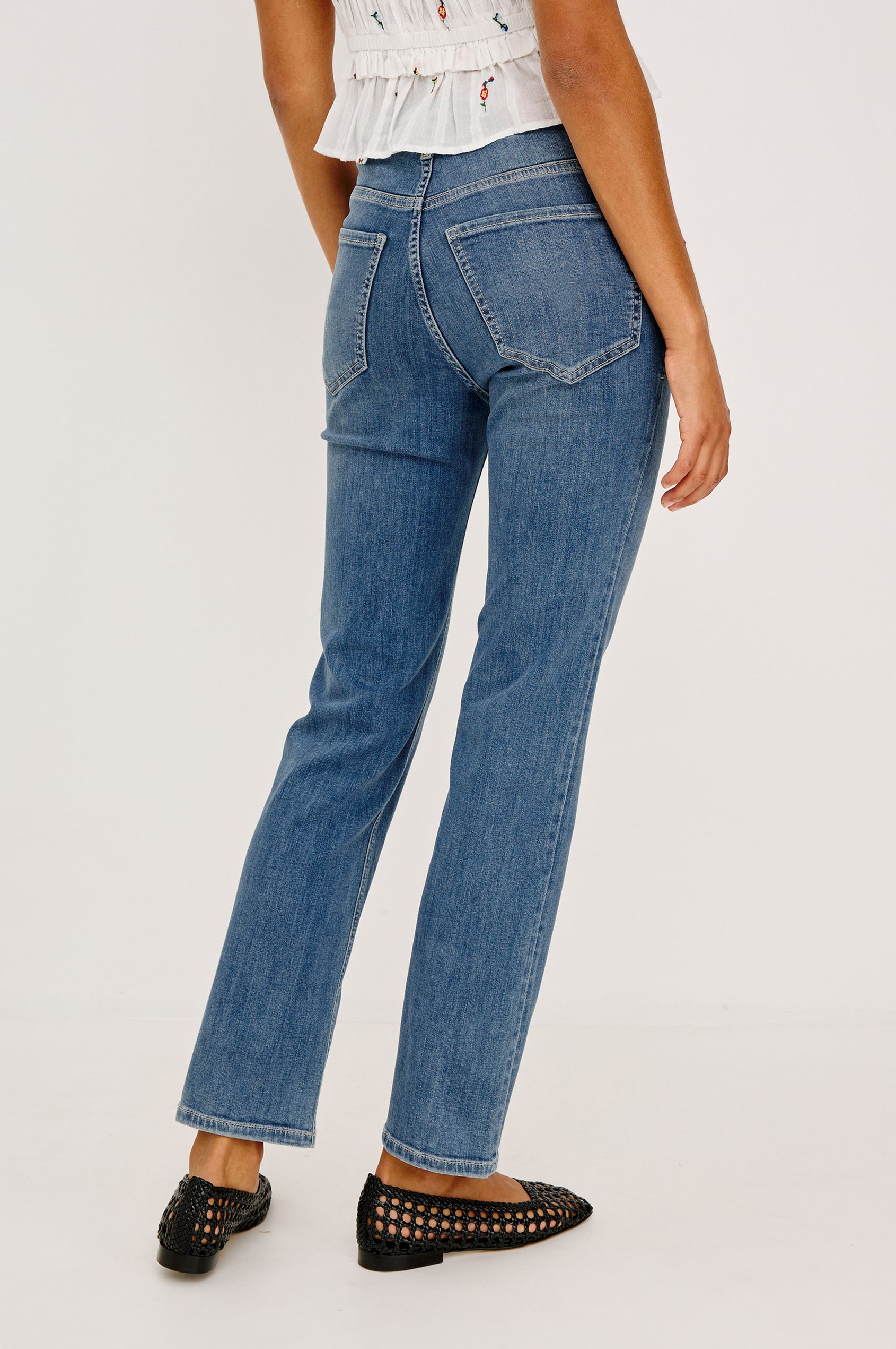 Bixby Mid-Rise Slim Straight Jean in High Stretch Denim With 28″ Inseam, Zip Fly, and 5-Pockets in East Coast Colorway - Lower Body Back View Featured on Model