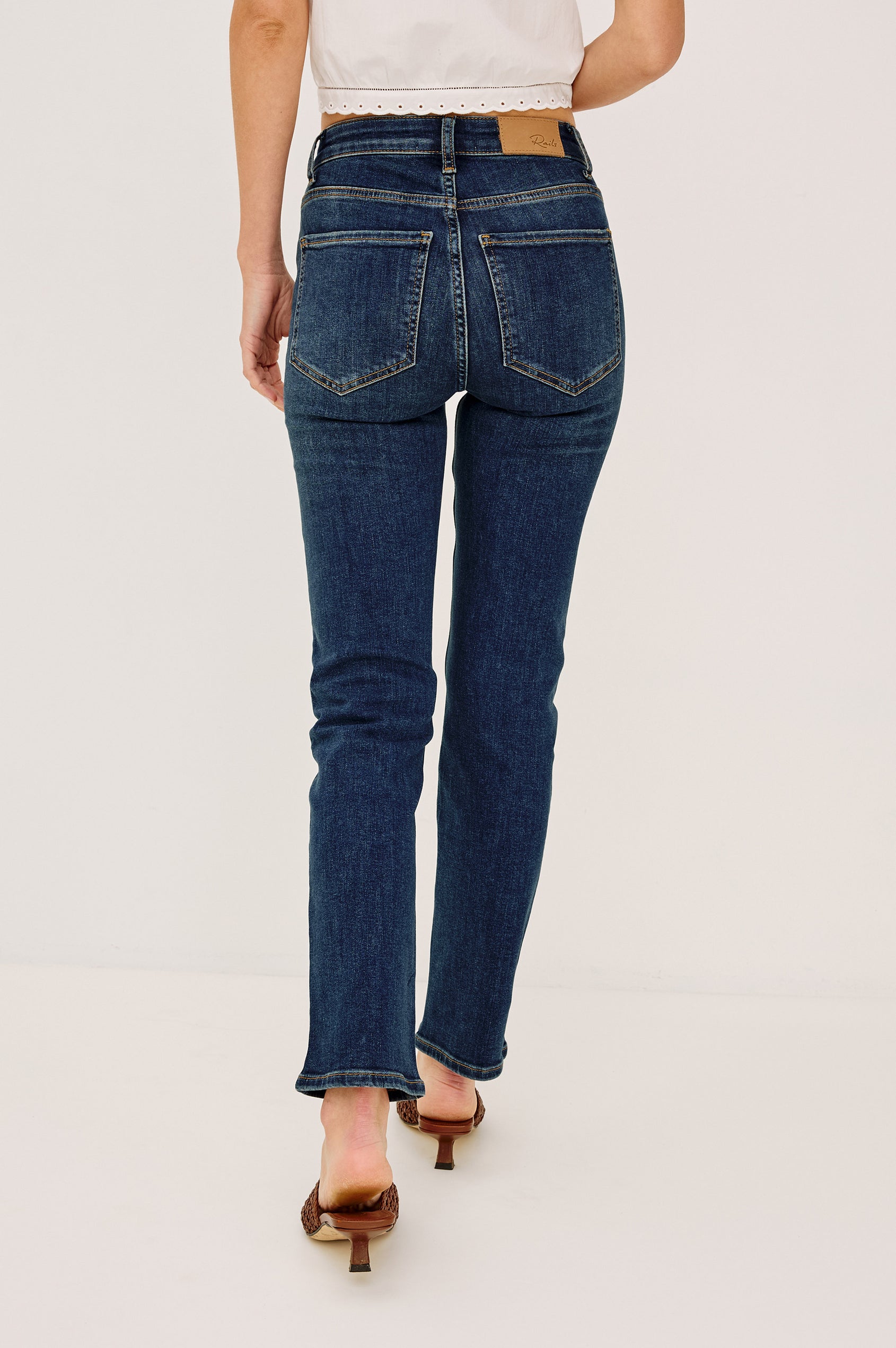 Bixby is a 5-pkt slim straight jean in Deep Dive colorway. Front view featured on model.