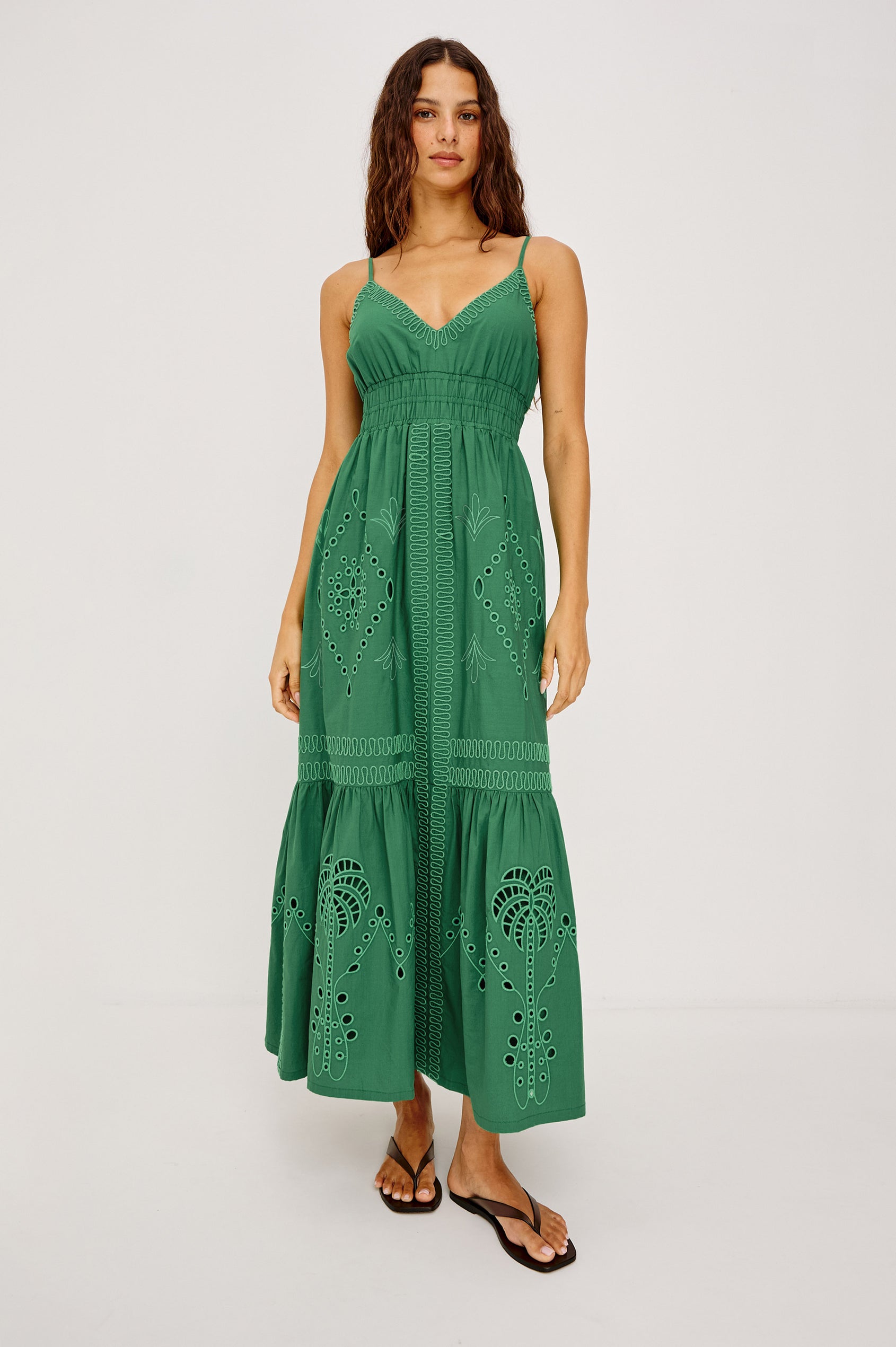 Blair Maxi Dress in Cotton Poplin With V-Neckline, Adjustable Spaghetti Straps, Elastic Waist Paneling, Soutache Tropical Embroidery, Back Smocking, Adjustable Shoulder Straps, and is Fully Lined in Clover Colorway - Full Body Front View Featured on Model