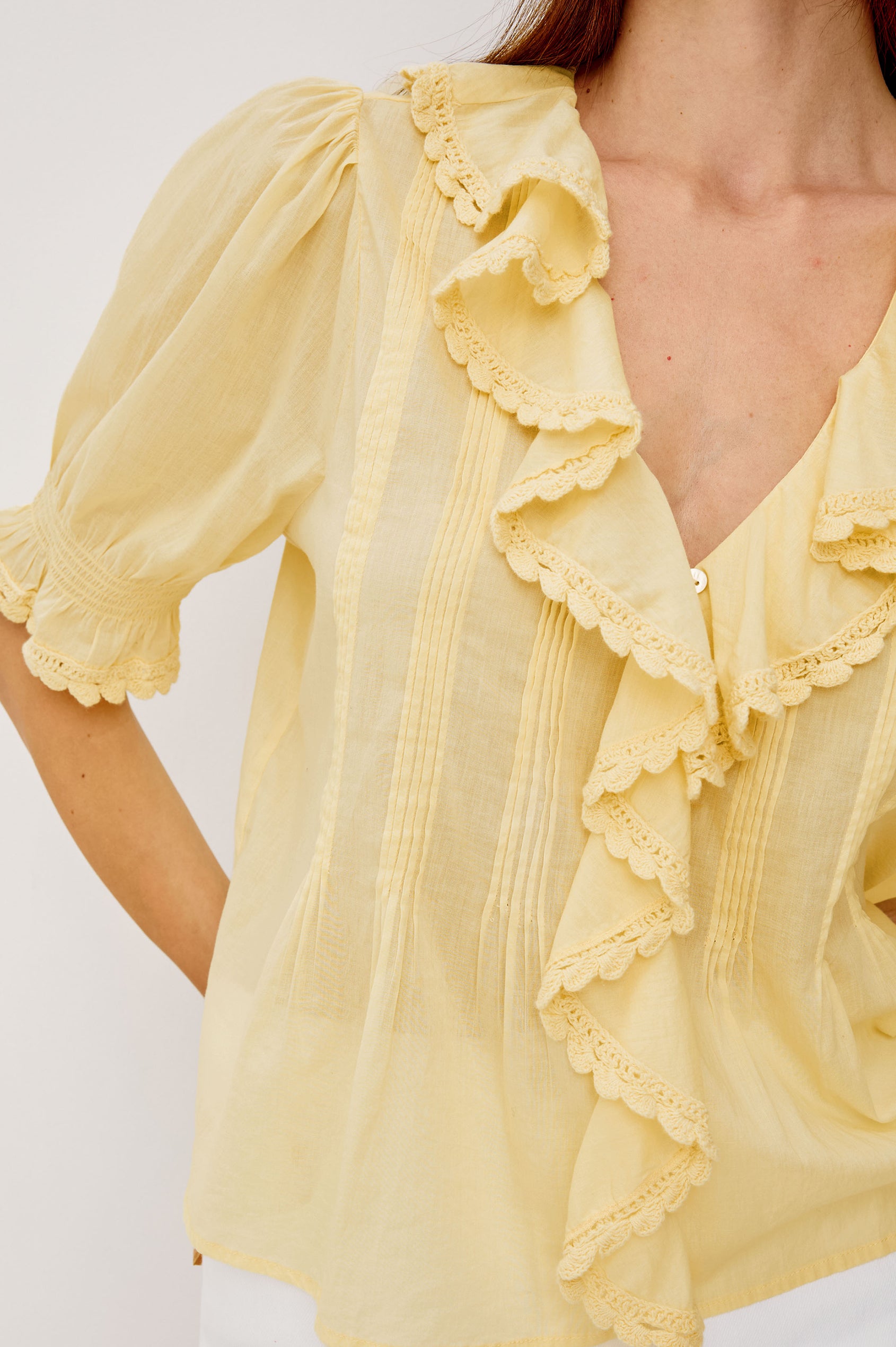 Bloom Poplin Top With Ruffle V-Neckline Elbow-Length Puff Sleeves With Ruffled Cuffs Pintuck Detailing and Boxy Relaxed Fit in Sunshine Colorway - Upper Body Front View Featured on Model