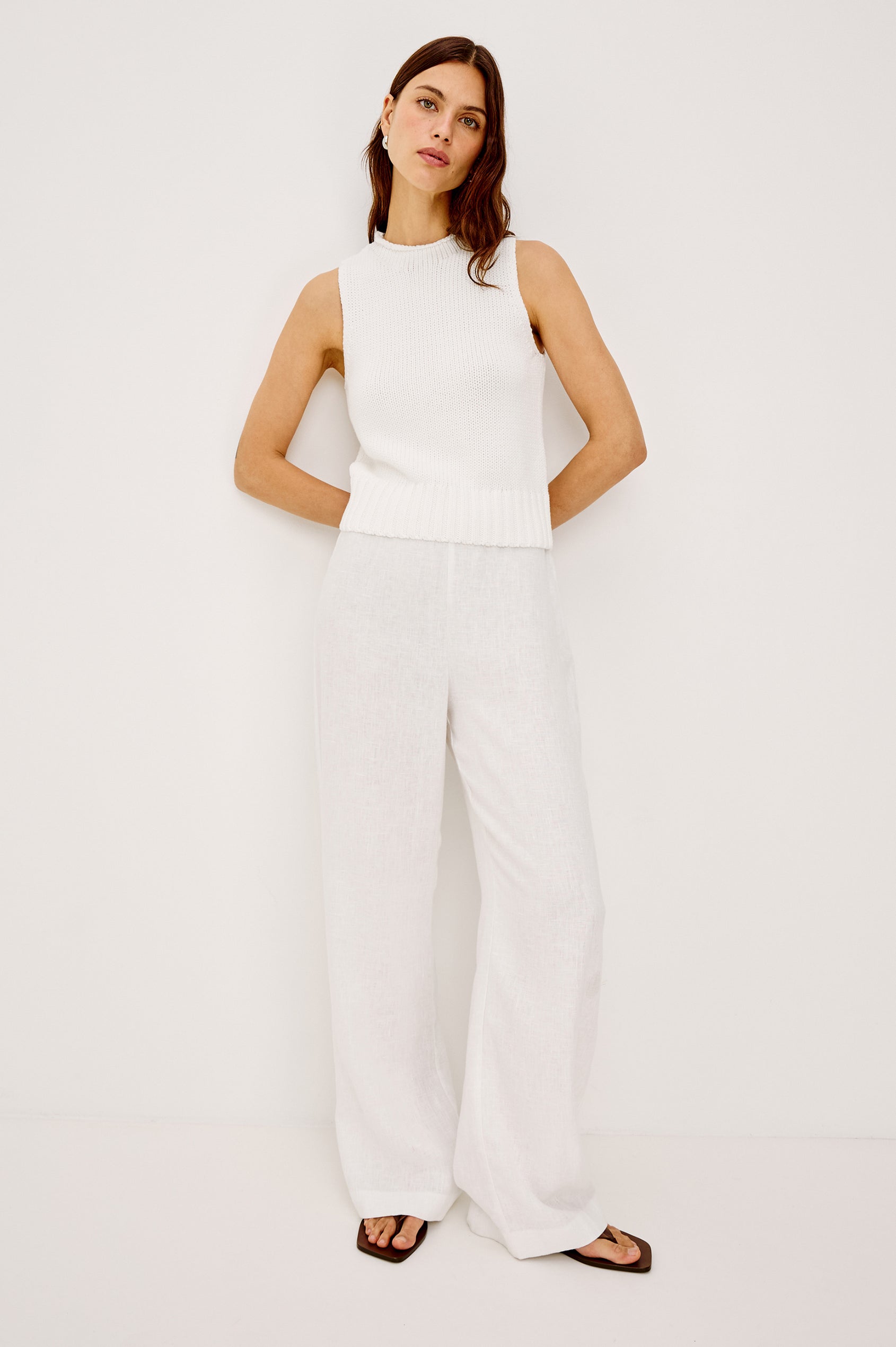 Bondi Sleeveless Vest in Soft Cotton Knit With Rolled Neckline, Relaxed Fit, and Ribbed Hem in White Colorway - Full Body Front View Featured on Model