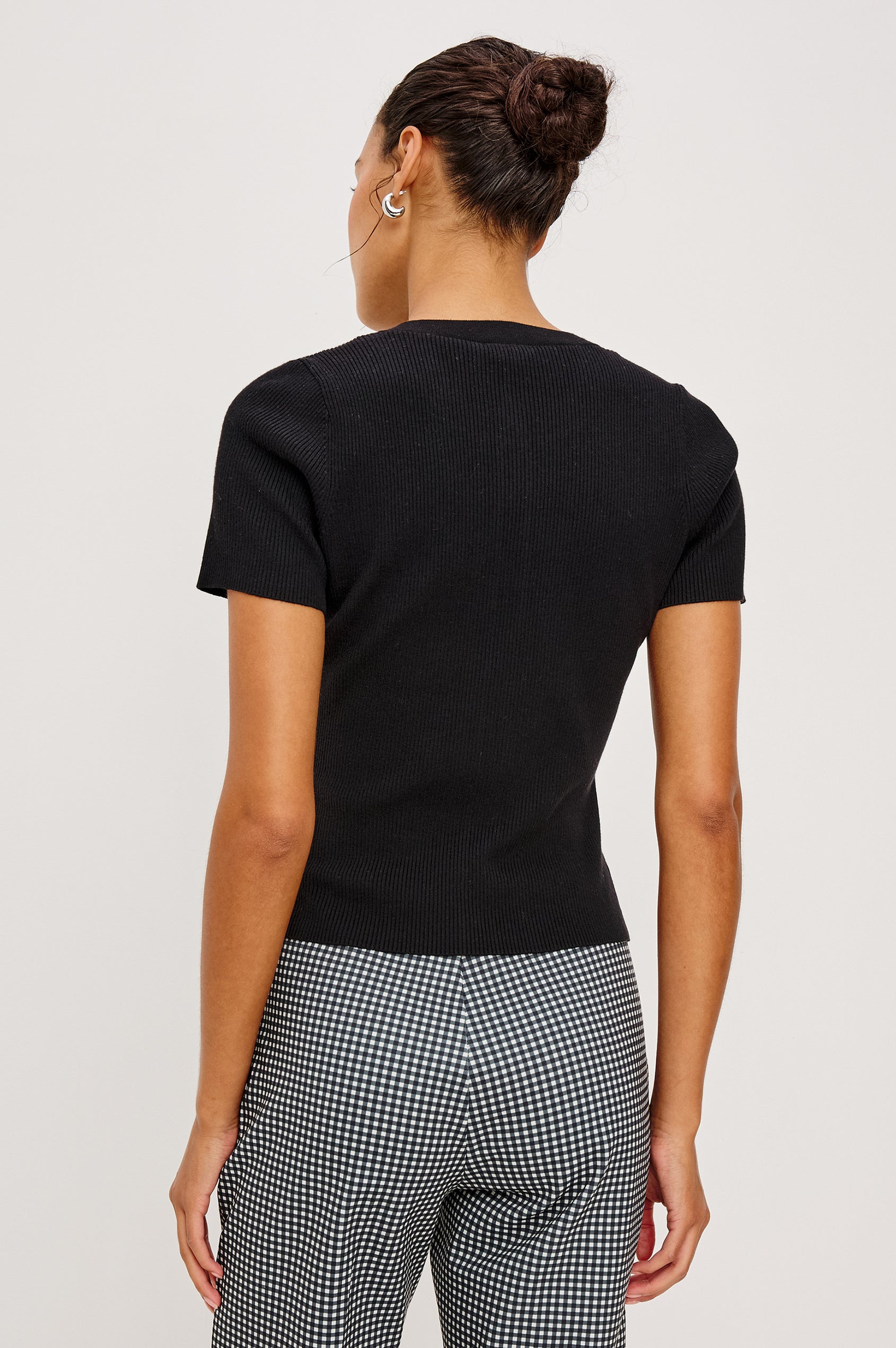 Bonnie Fitted Top in Ribbed Cotton With Crew Neckline Short Sleeves and Front Buttons in Black Colorway - Upper Body Back View Featured on Model