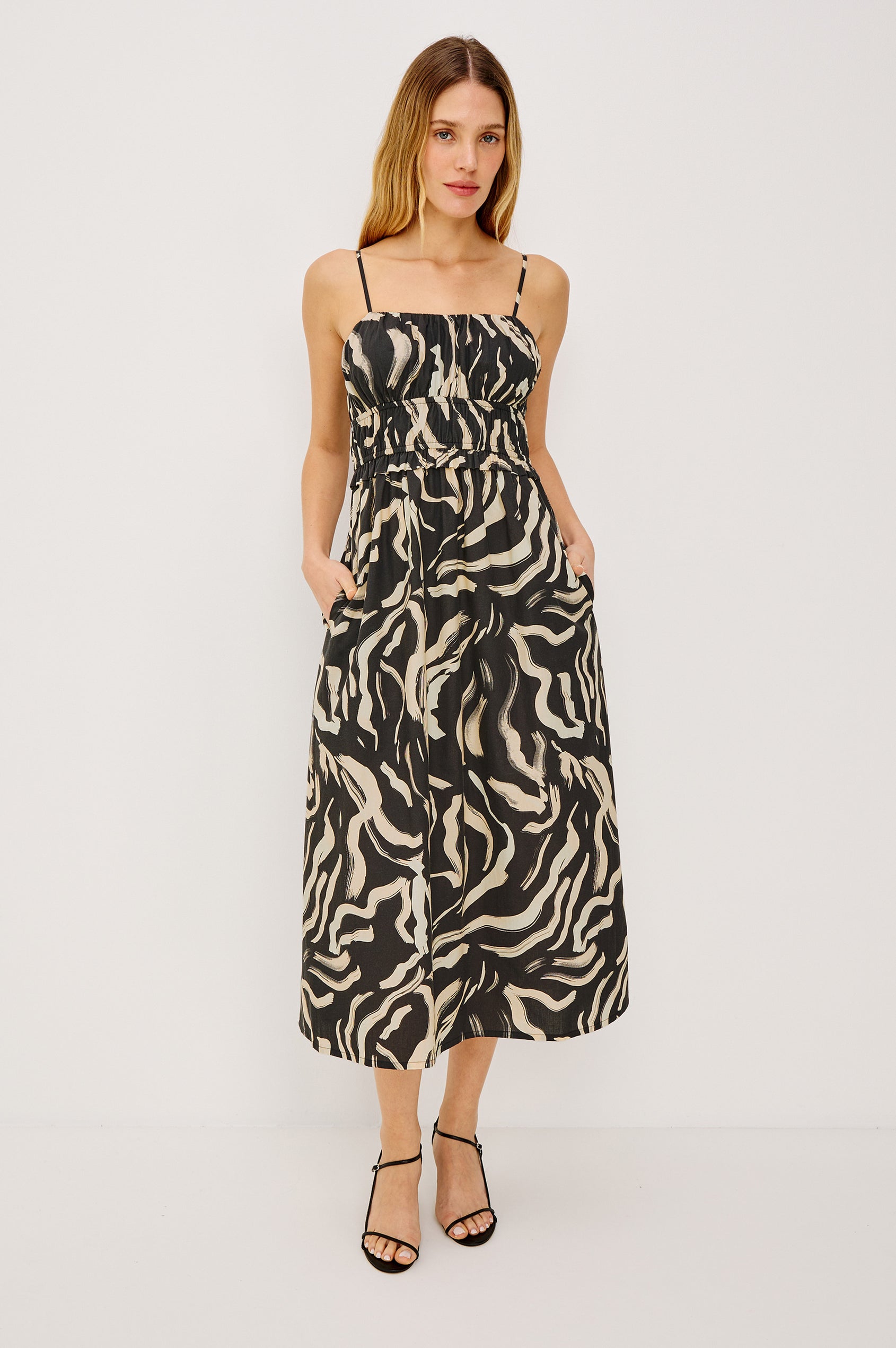 Breeze Midi Dress in Cotton Poplin With Adjustable Spaghetti Shoulder Straps, Gathered Bust, Smocked Waist, Side Pockets, and Full Skirt in Caicos Colorway - Full Body Front View Featured on Model