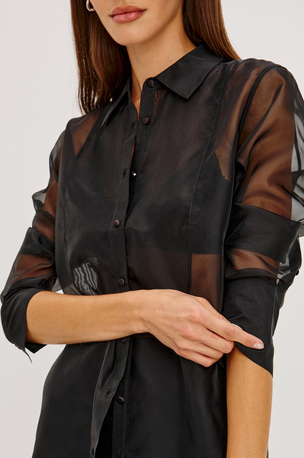 The Bretton Shirt in Sheer Organza With Oversized Fit, Spread Collar, Front Button Placket, and Long Sleeves in Black Organza Colorway - Upper Body Front Detail View Featured on Model.
