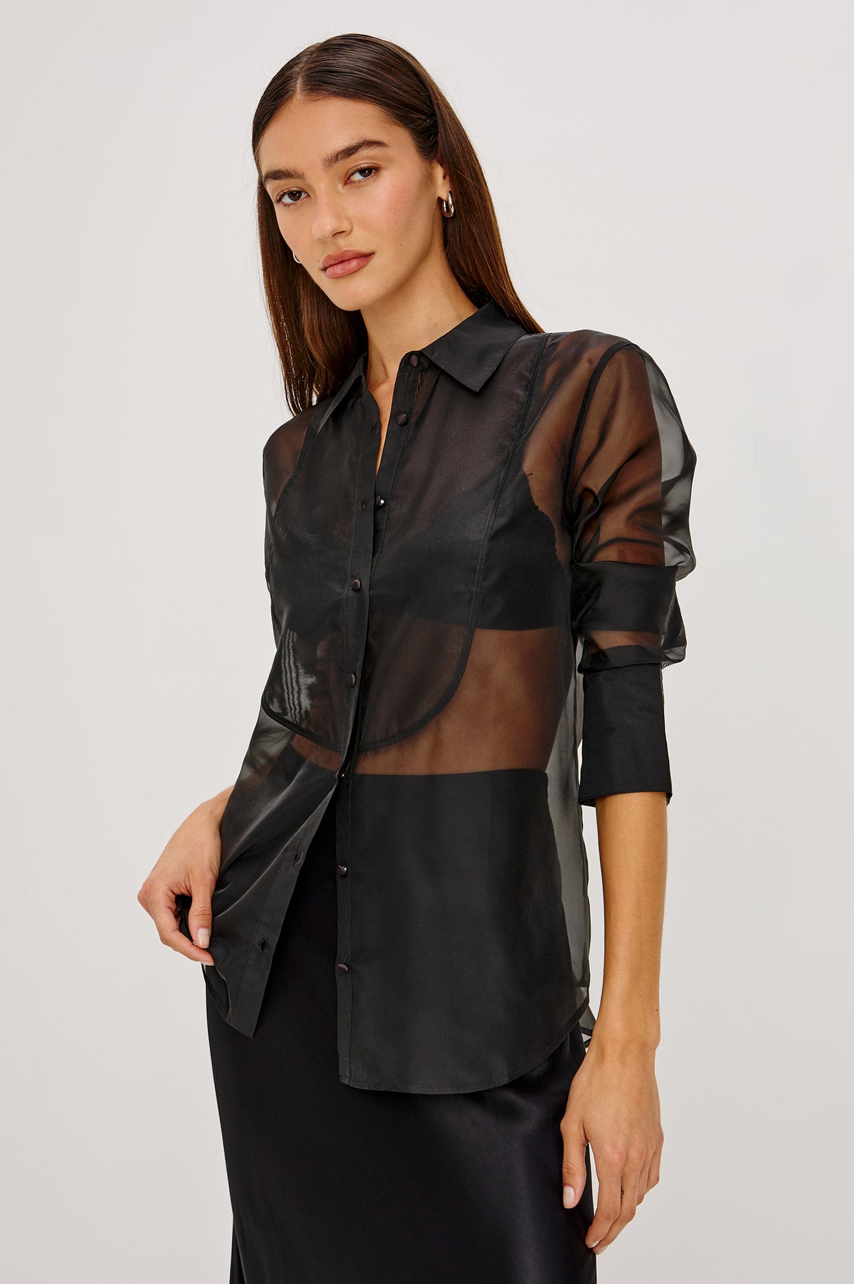 The Bretton Shirt in Sheer Organza With Oversized Fit, Spread Collar, Front Button Placket, and Long Sleeves in Black Organza Colorway - Front View Featured on Model.