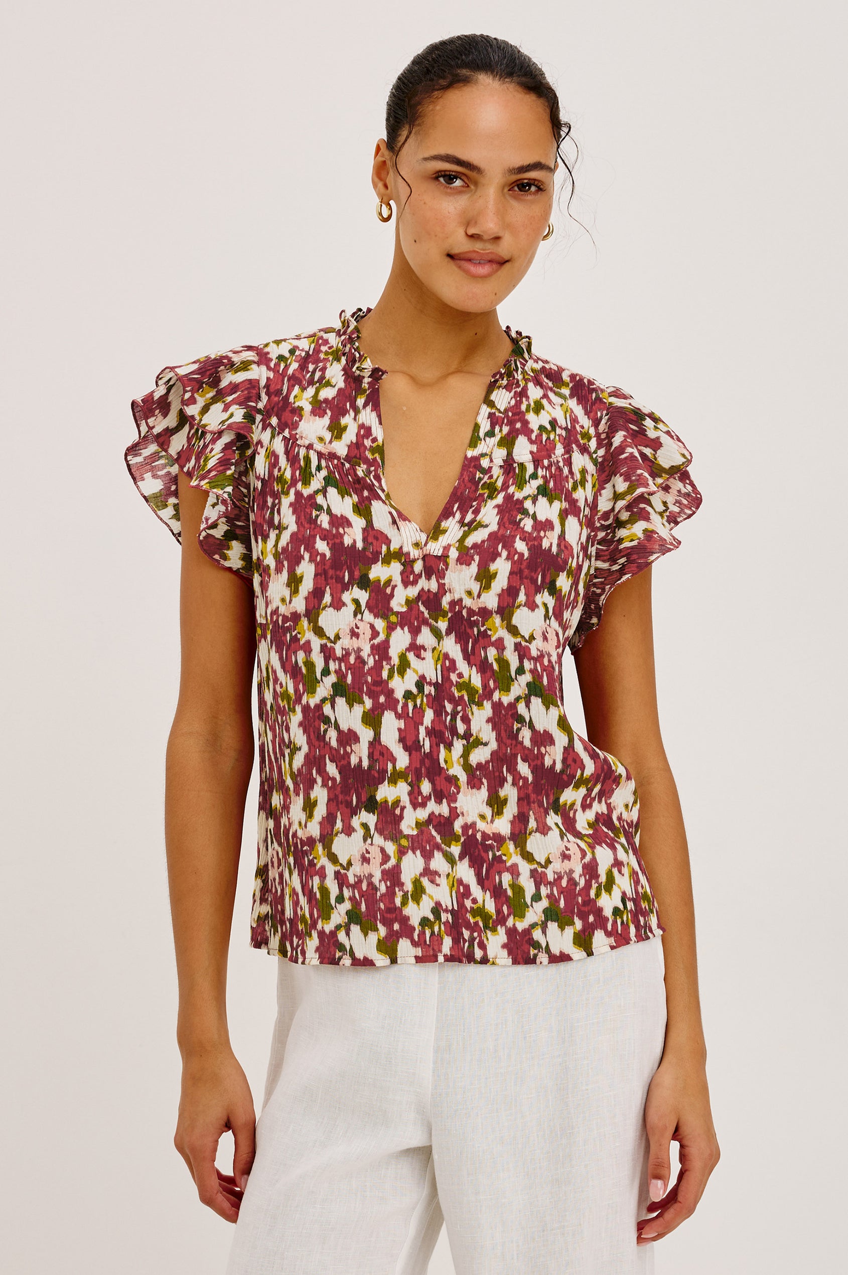 Calista Top in Textured Chiffon With Ruffle Trim Split V-Neckline, Layered Flutter Sleeves, and Relaxed Fit in Cardinal Floral Colorway - Upper Body Front View Featured on Model