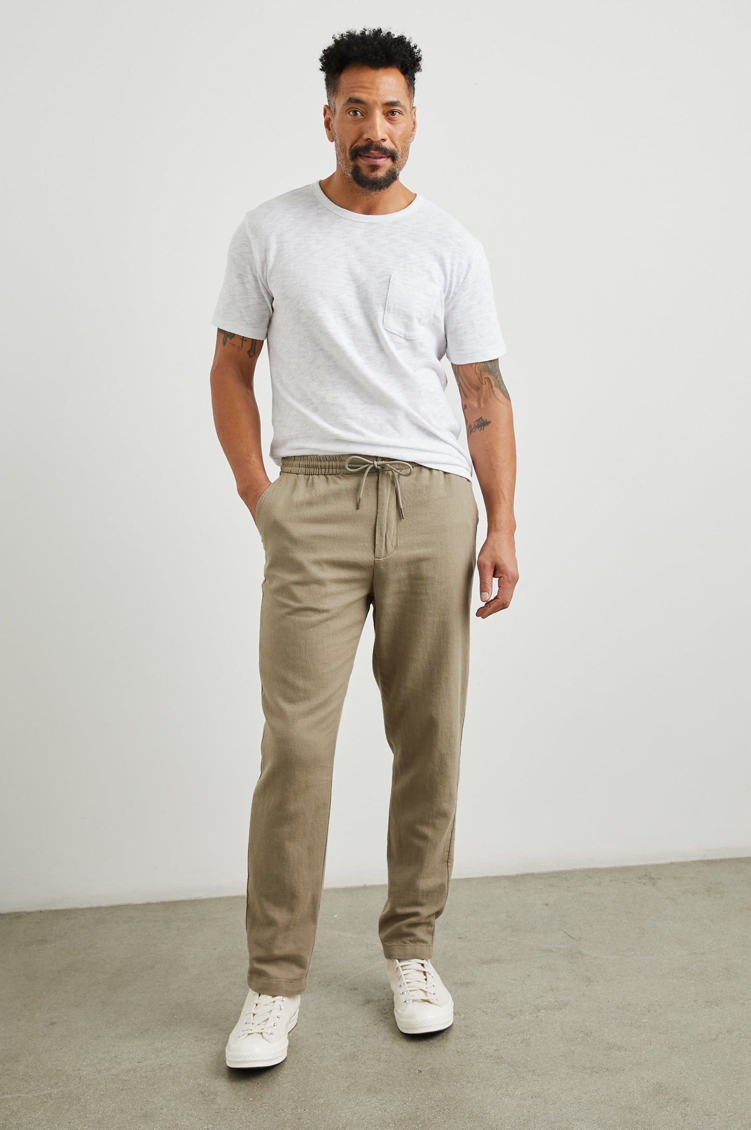 Callum Pants with a Drawstring Waist, Two Front Pockets and a Back Patch Pocket in Barley Colorway - Front Full Body View Featured on Model