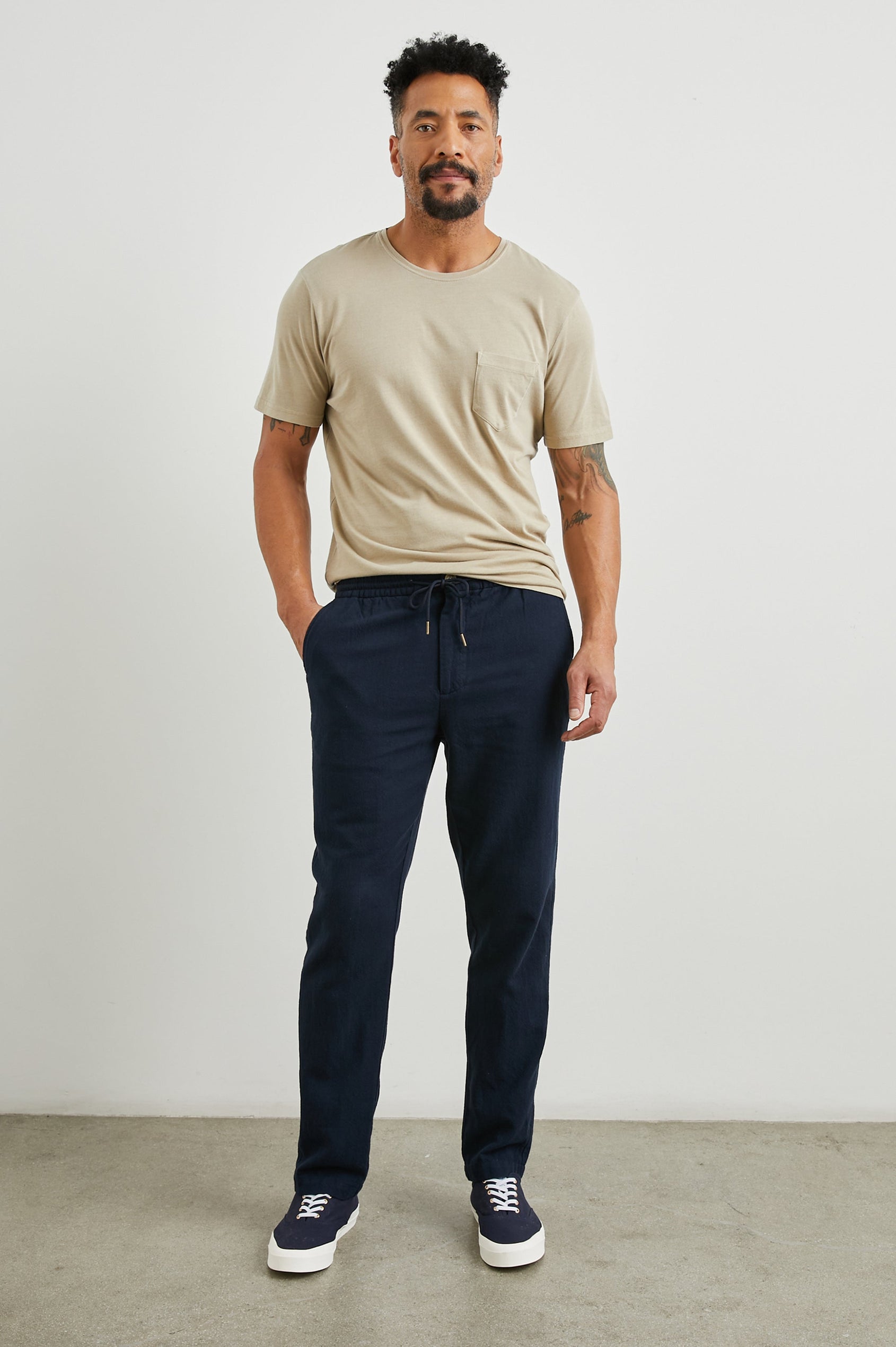 Callum Pants with a Drawstring Waist, Two Front Pockets and a Back Patch Pocket in Deep Meridian Colorway - Front Full Body View Featured on Model