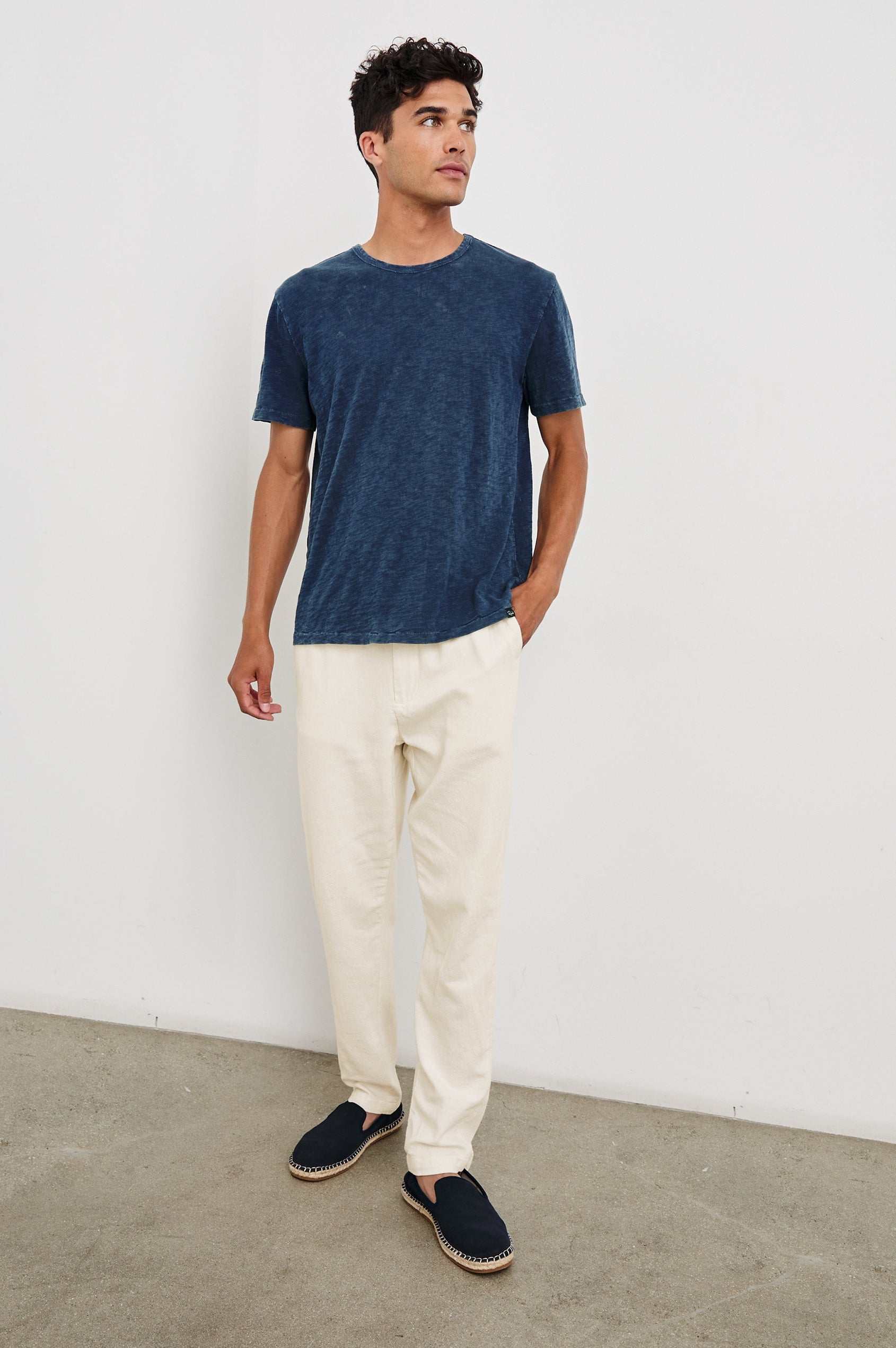 Callum Pants with a Drawstring Waist, Two Front Pockets and a Back Patch Pocket in Ecru Colorway - Front Full Body View Featured on Model