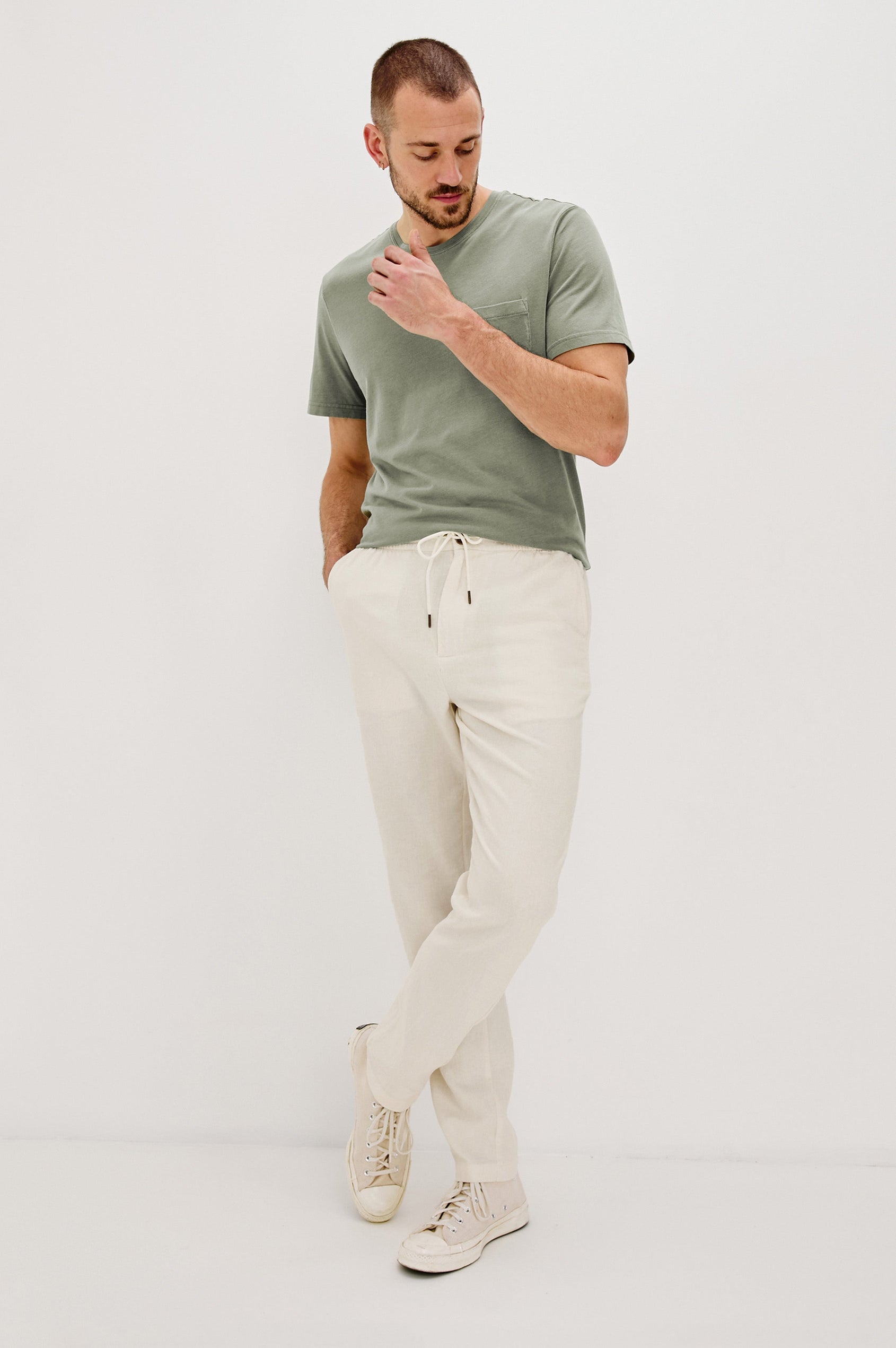 Callum extended length linen straight leg pant with elastic waistband and adjustable drawstring in Ecru - full body front view on model