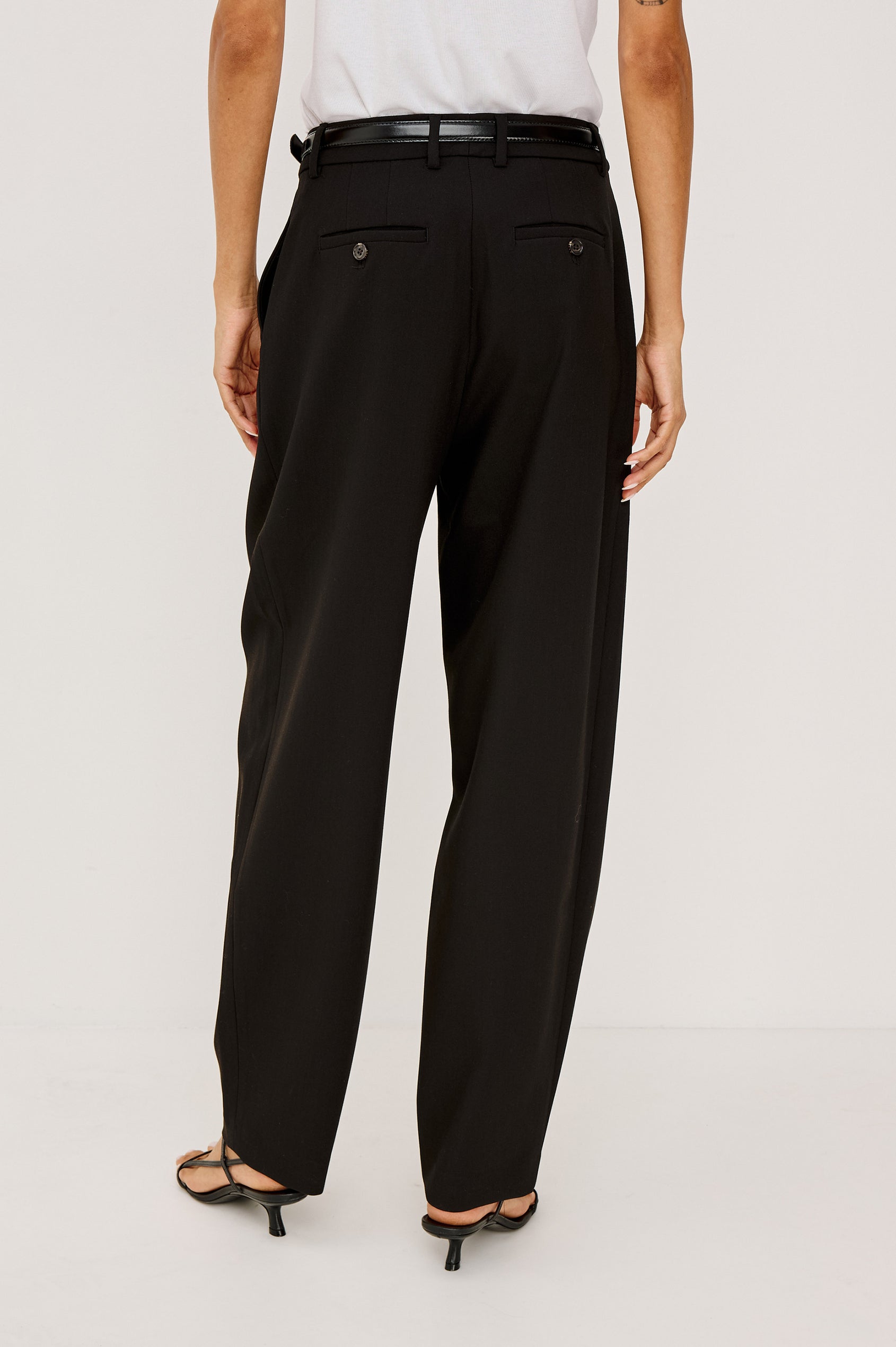 Cameron Pant in Springy Suiting Fabric With High-Rise, Pleated Barrel Legs That Taper, Side and Back Pockets, and Unlined in Black Colorway - Lower Body Back View Featured on Model