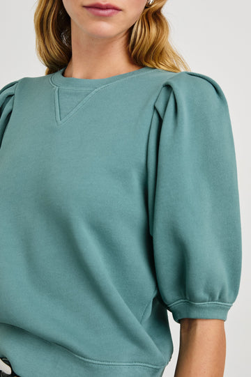 Camy Sweatshirt with Elbow Length Puff Sleeves and a Crew Neck in Stone Blue Colorway - Front View Featured on Model 