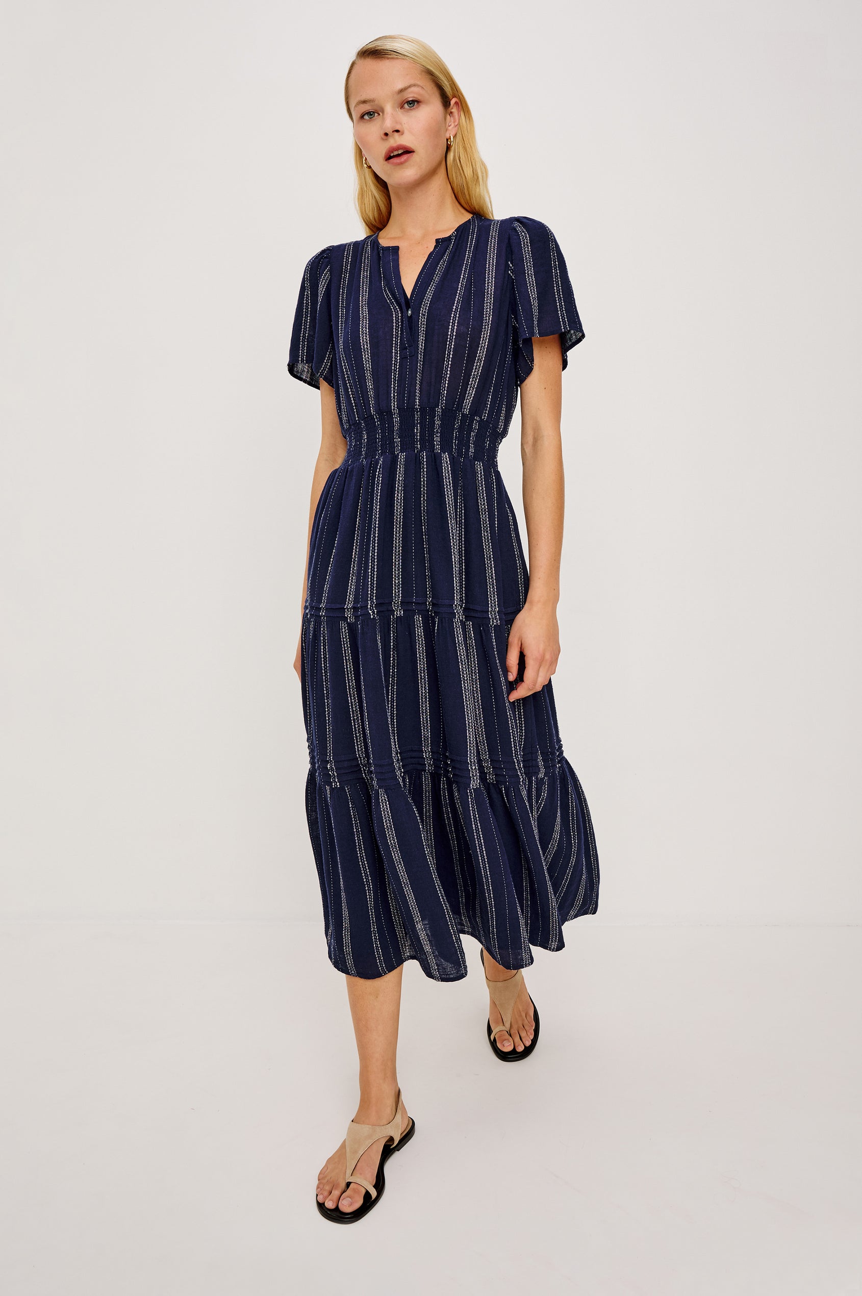 Cannes Midi Dress in Linen With Front Placket Short Sleeves and Smocked Elastic Waist in Marina Stripe Colorway - Full Body Front View Featured on Model