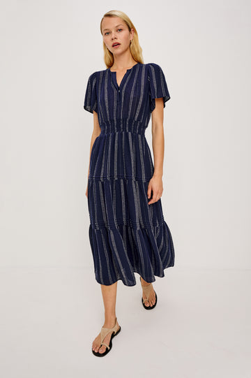 Cannes Midi Dress in Linen With Front Placket Short Sleeves and Smocked Elastic Waist in Marina Stripe Colorway - Full Body Front View Featured on Model