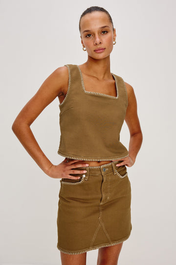 Carbon Denim Tank Top with Wide Straps, Square Neckline and Blanket Stitching on Edges in Safari Embroidered Colorway. Front View on Model Shown.