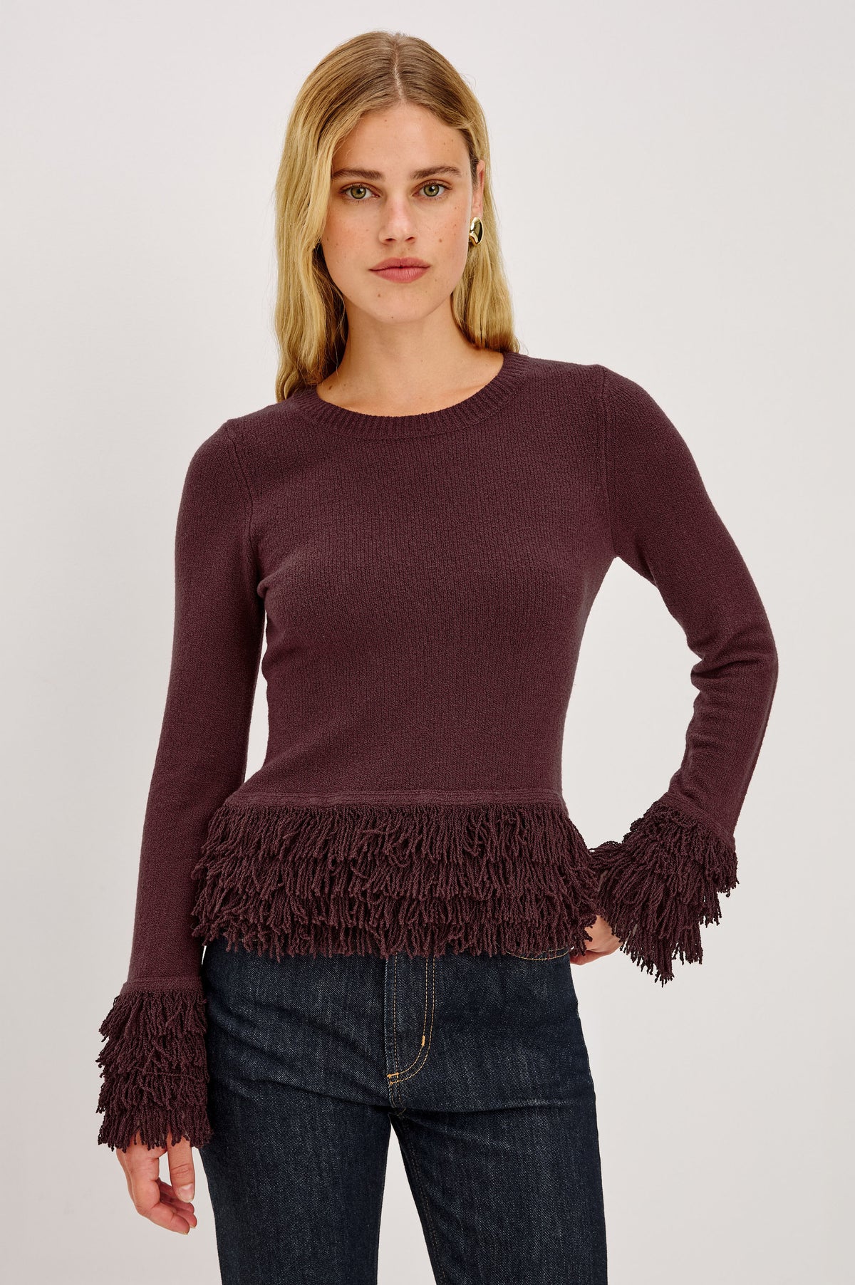 Carmen Sweater in Ribbed Knit With Fringe Trim Hem and Cuffs, Crew Neck, and Long Sleeves in Wine Colorway - Upper Body Front View Featured on Model.