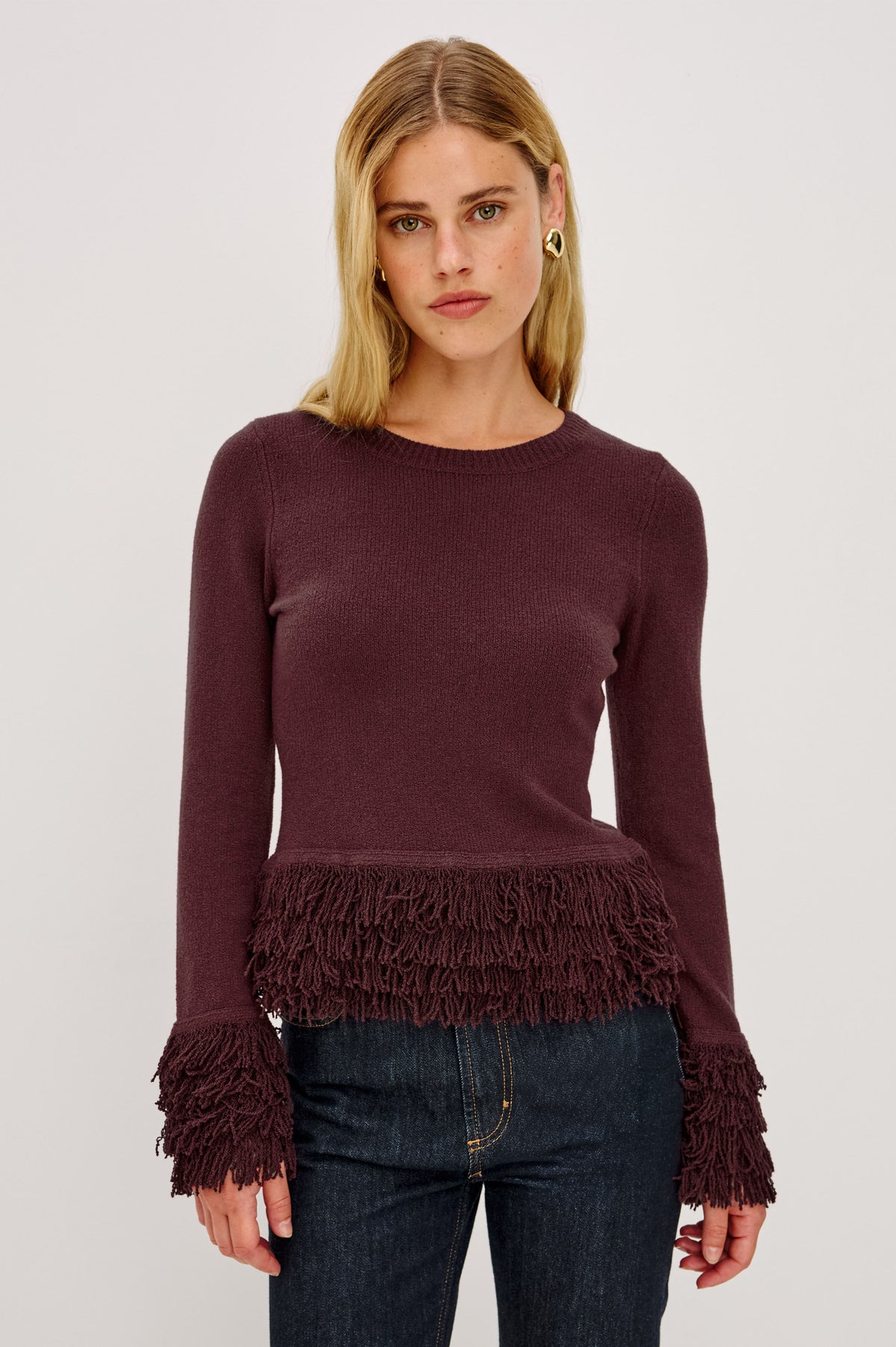 Carmen Sweater in Ribbed Knit With Fringe Trim Hem and Cuffs, Crew Neck, and Long Sleeves in Wine Colorway - Front View Featured on Model.