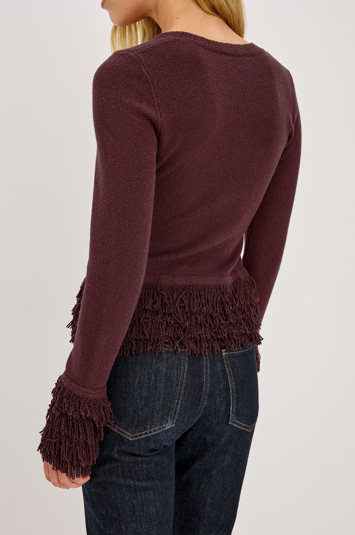 Carmen Sweater in Ribbed Knit With Fringe Trim Hem and Cuffs, Crew Neck, and Long Sleeves in Wine Colorway - Upper Body Back View Featured on Model.