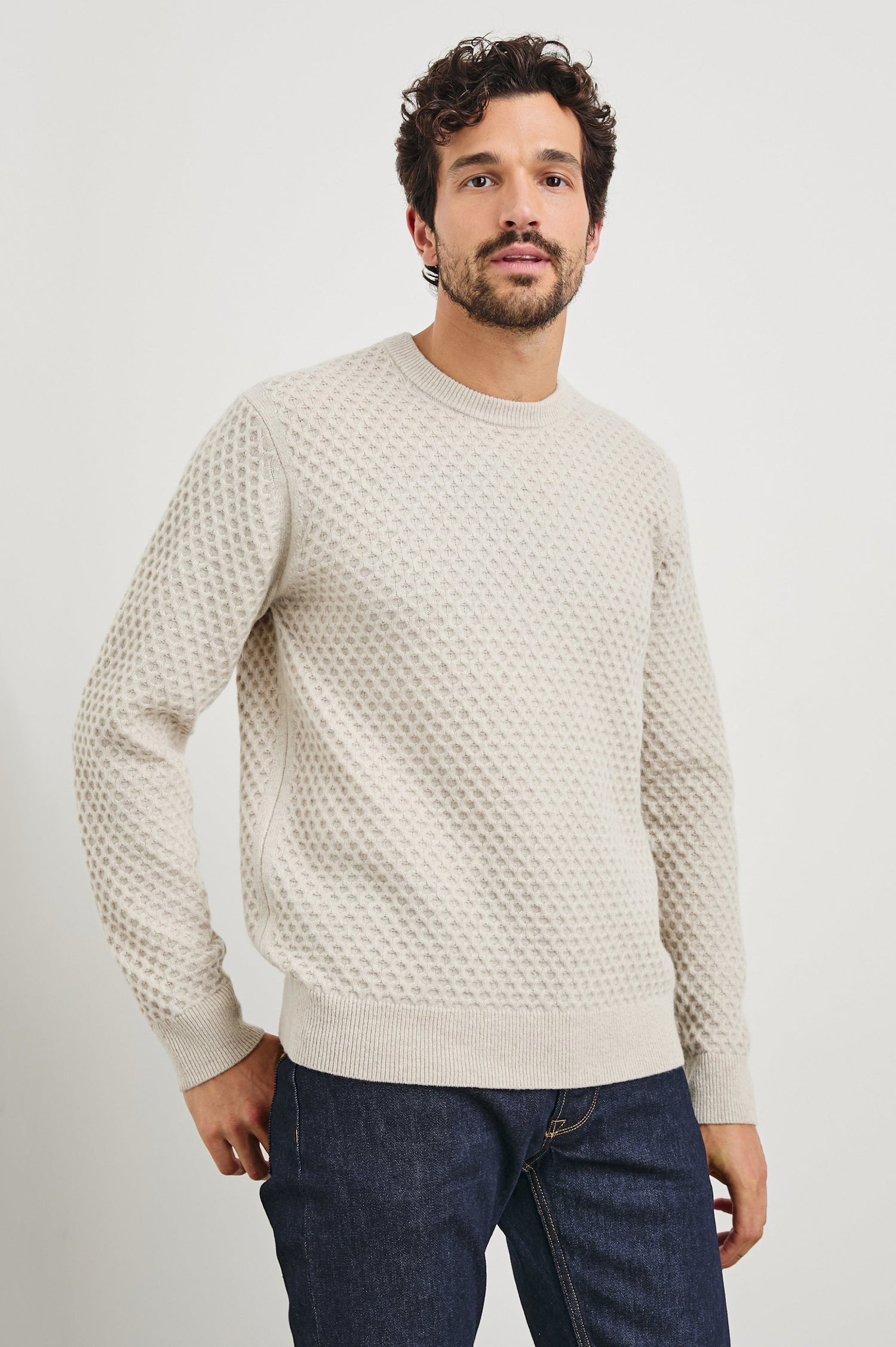 Carrick Long-Sleeve Sweater with a Crew Neck, Honeycomb Stitch, and Ribbed Trim in Oatmeal Heather Colorway - Front View Featured on Model