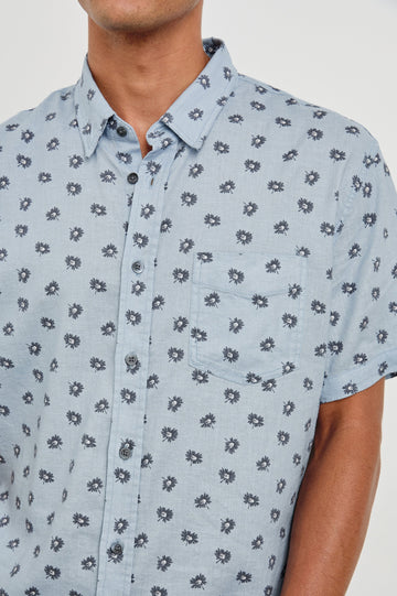 Carson linen short sleeve button down with a collar and floral pattern in Daisy Toss Celestial - close up of details on model