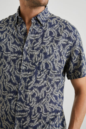 Carson Short Sleeve Button Up with a Chest Patch Pocket in Palm American Navy Colorway, Tan Fronds on Navy - Front View Featured on Model