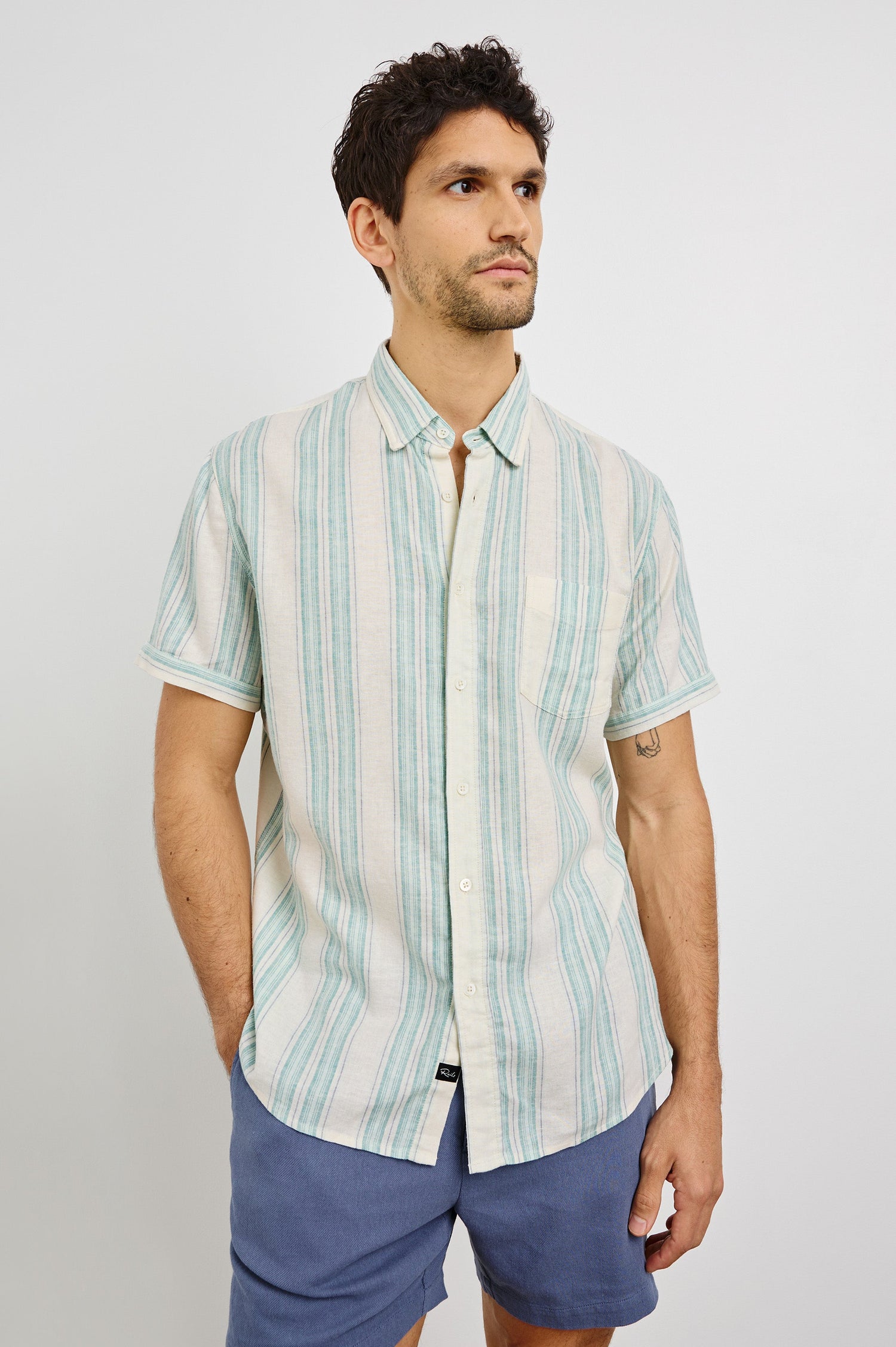 Carson Collared Button Front Shirt with Short Sleeves and a Chest Pocket in Riviera Stripe Colorway. Front View Shown on Model.
