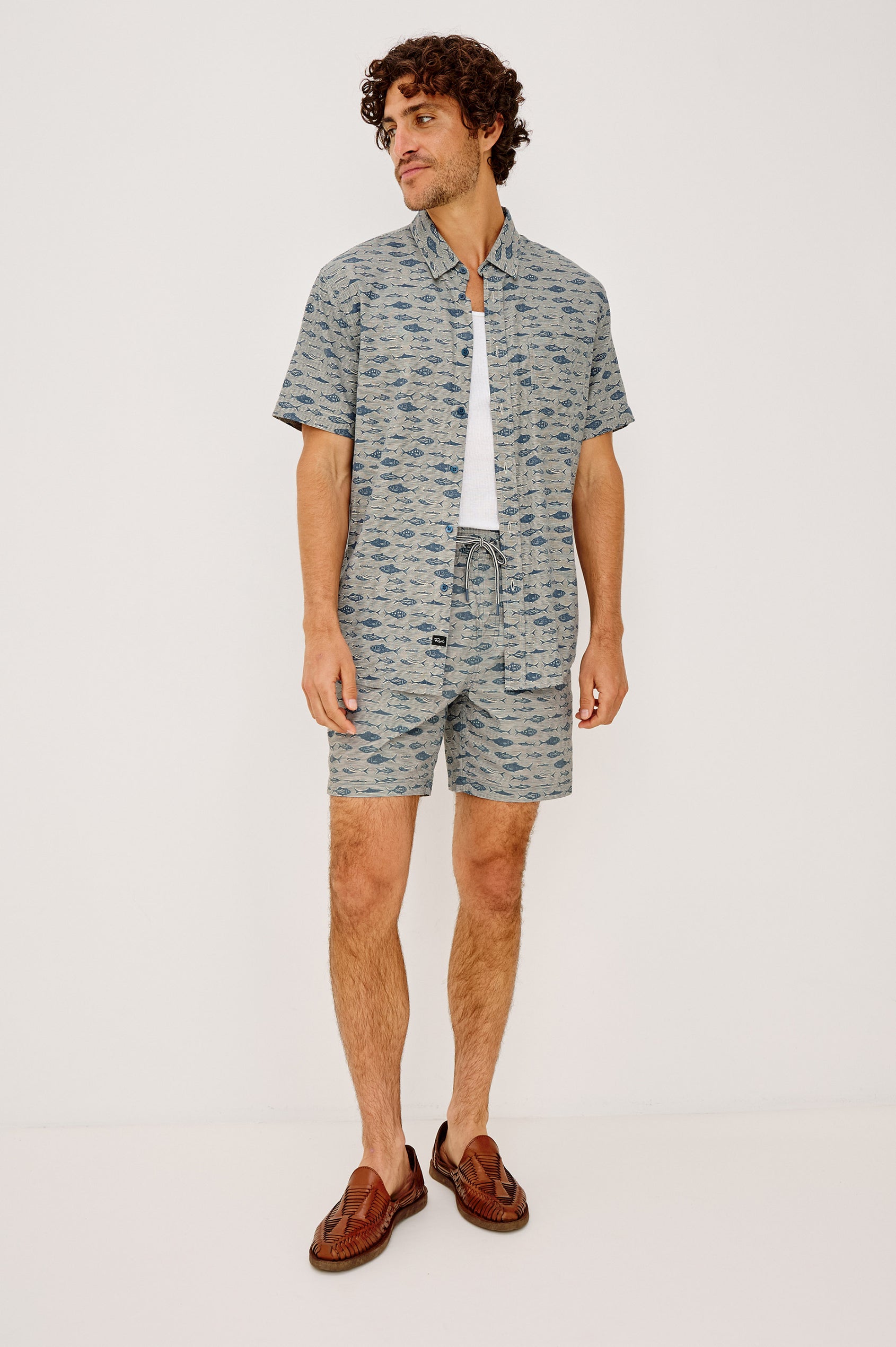 Carson Button-Up Shirt in Lighweight Seersucker With Collar, Chest Patch Pocket, Short Sleeves, and Classic Fit in Vintage Aquarium Etch Batik Colorway - Full Body Front View Featured on Model