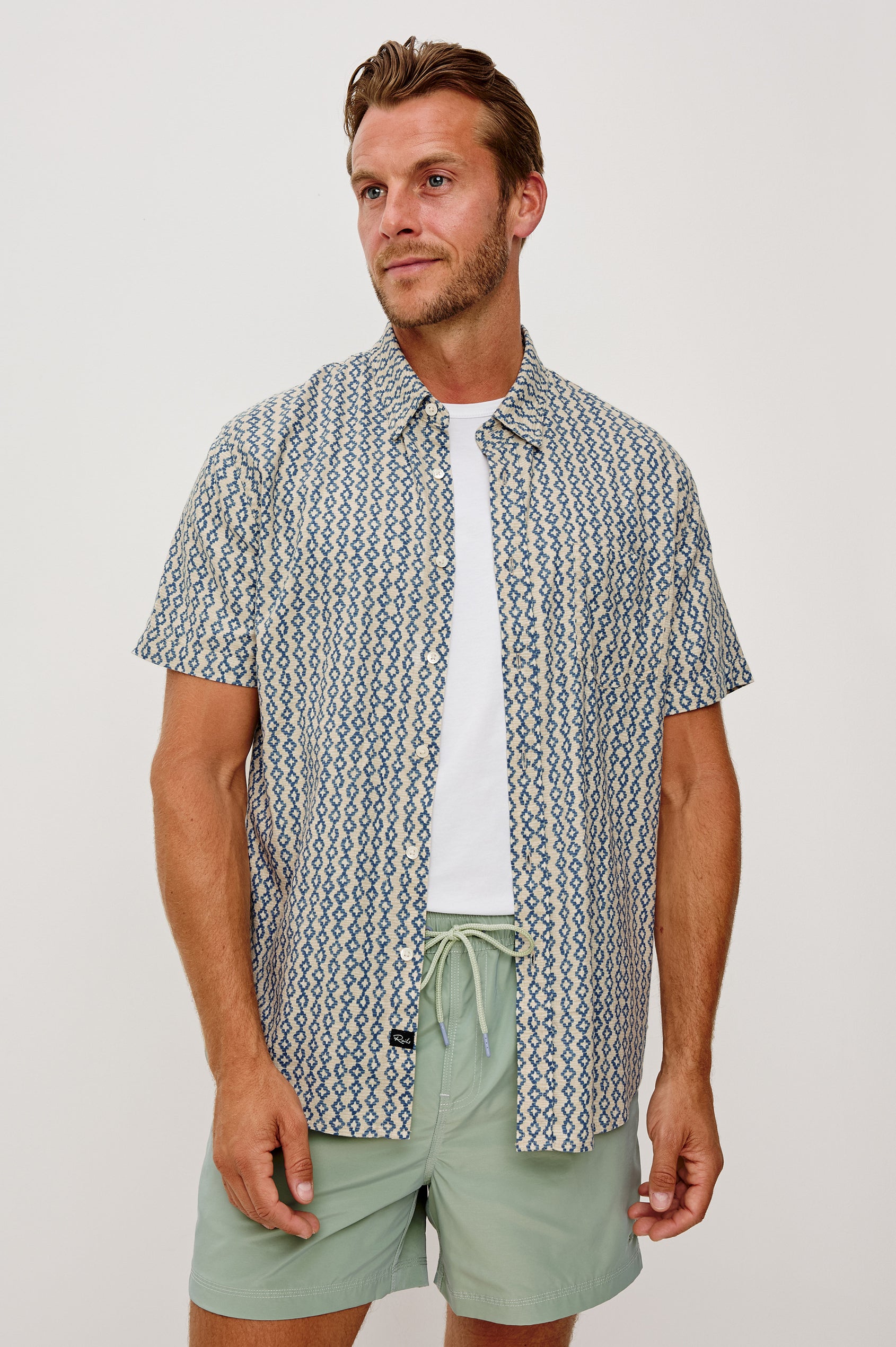 Carson Button-Up Short Sleeve Shirt in Linen Blend With Collar and Classic Fit in Wavy Batik Coast Colorway - Upper Body Front View Featured on Model