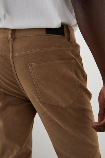 Carver Pants with Belt Loops, Two Front Pockets plus a Coin Pocket and Two Back Patch Pockets in Corduroy Sandstone Colorway - Back View Featured on Model
