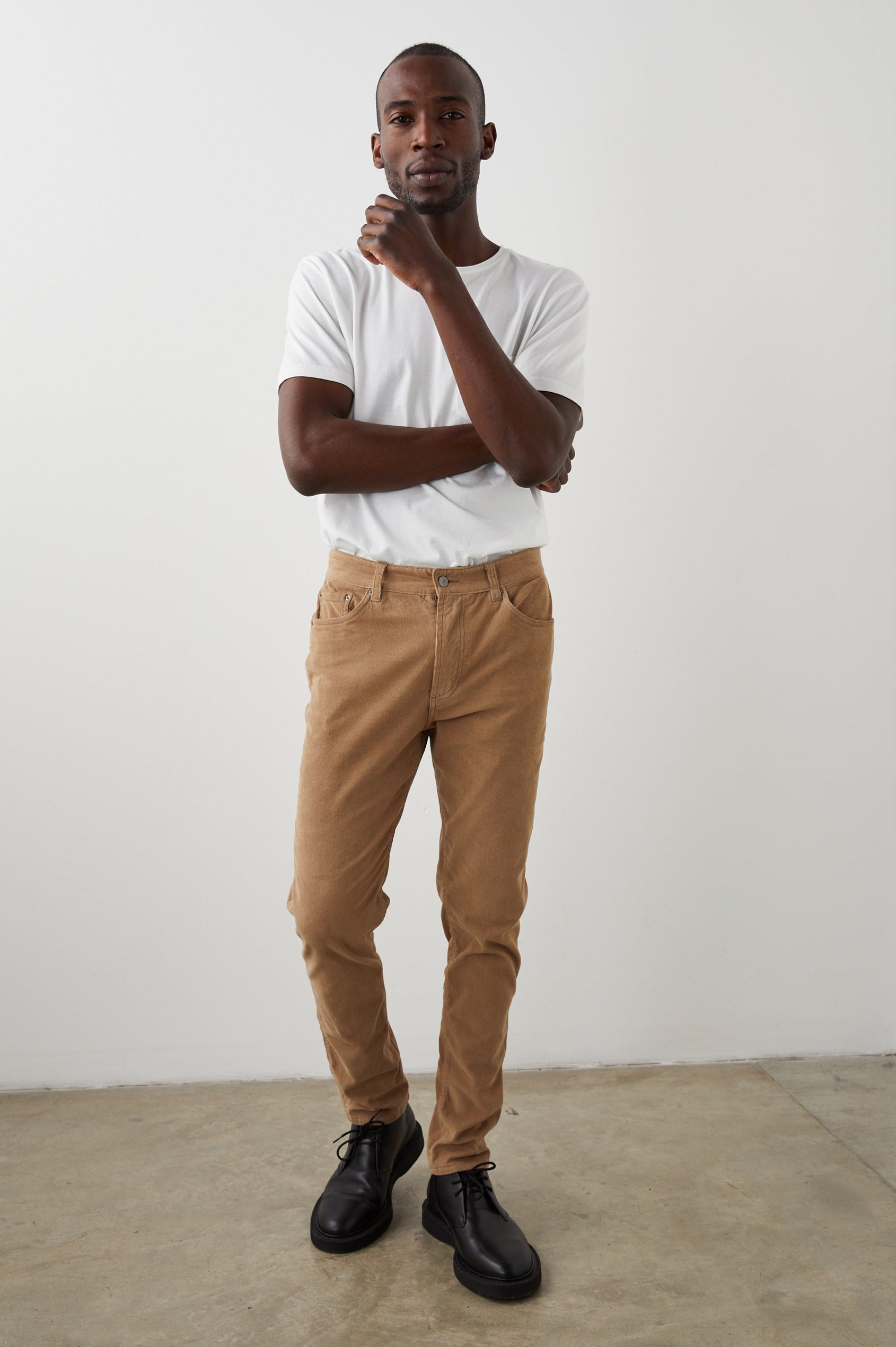 Carver Pants with Belt Loops, Two Front Pockets plus a Coin Pocket and Two Back Patch Pockets in Corduroy Sandstone Colorway - Front Full Body View Featured on Model