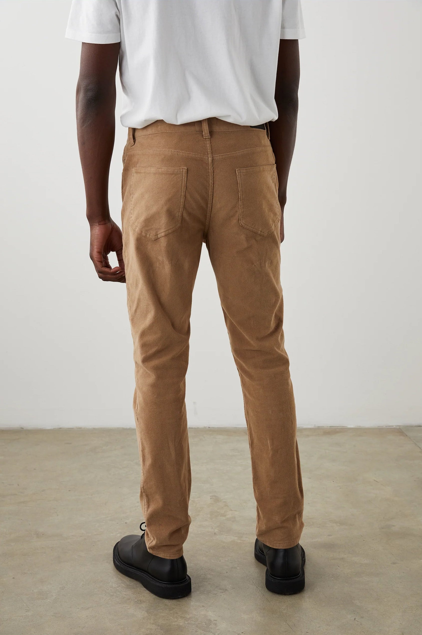 Carver Pants with Belt Loops, Two Front Pockets plus a Coin Pocket and Two Back Patch Pockets in Corduroy Sandstone Colorway - Back View Featured on Model