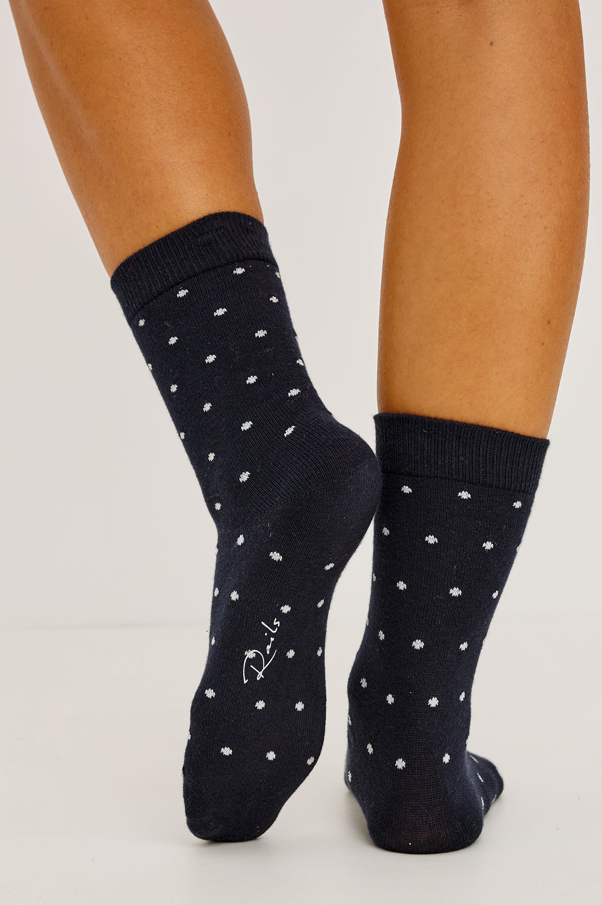 Cashmere Crew Socks in Soft Cotton-Cashmere Blend With Ribbed Cuffs in Navy Polka Dot Colorway - Full Body Front View Featured on Model.