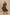 Caterine Maxi Dress with Mid-length Sleeves, a V neck, a Shirred Collar with a tie, a Smocked Waist, and a Tiered Skirt in Brown Nala Colorway - Stylized Full Body Front View Featured on Model, in Motion