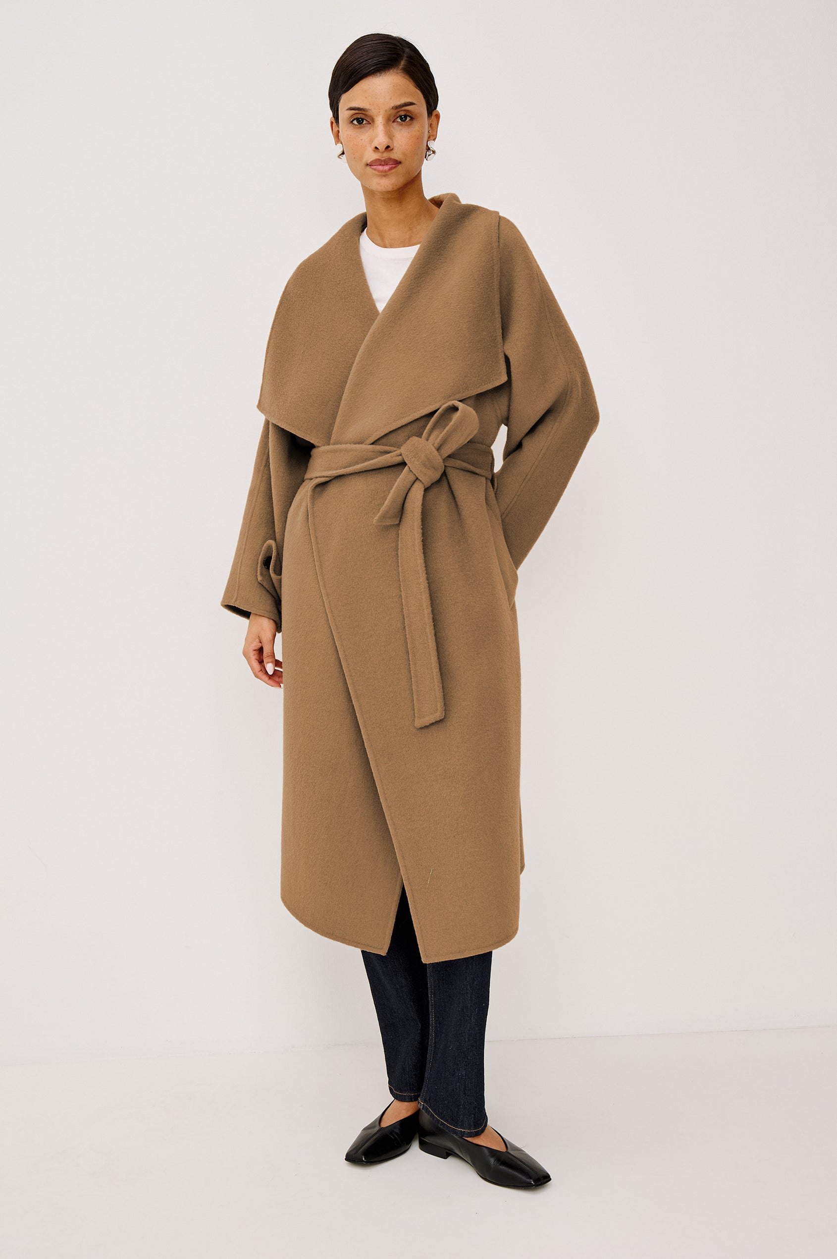 Celeste Coat in Heavy Wool Blend With Shawl Collar, Full Length, Self-Belted Waist, Side Pockets, Button-Tab Cuffs, and Half-Lined Interior in Camel Colorway - Full Body Front View Featured on Model