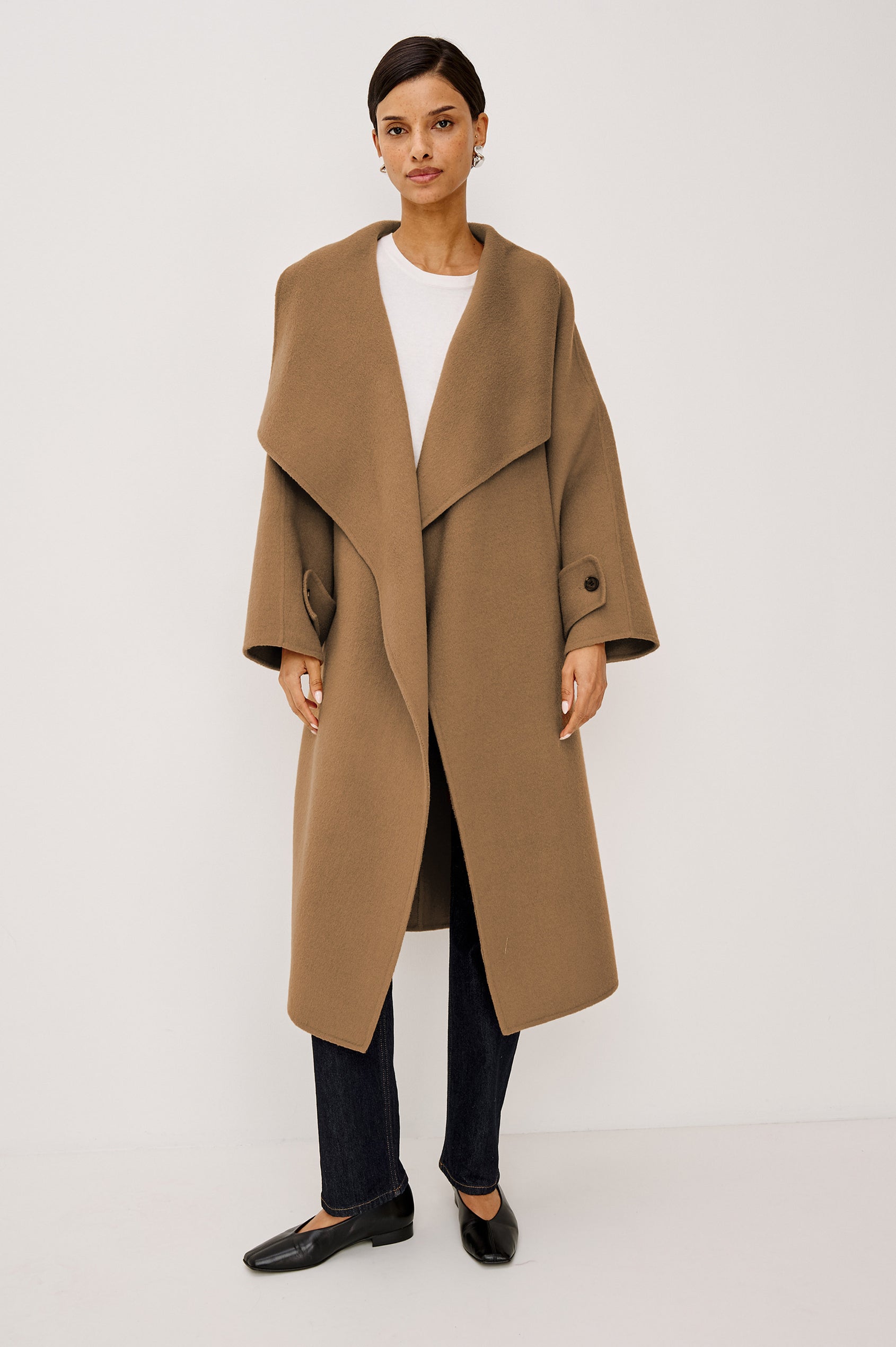 Celeste Coat in Heavy Wool Blend With Shawl Collar, Full Length, Self-Belted Waist, Side Pockets, Button-Tab Cuffs, and Half-Lined Interior in Camel Colorway - Full Body Front View Featured on Model