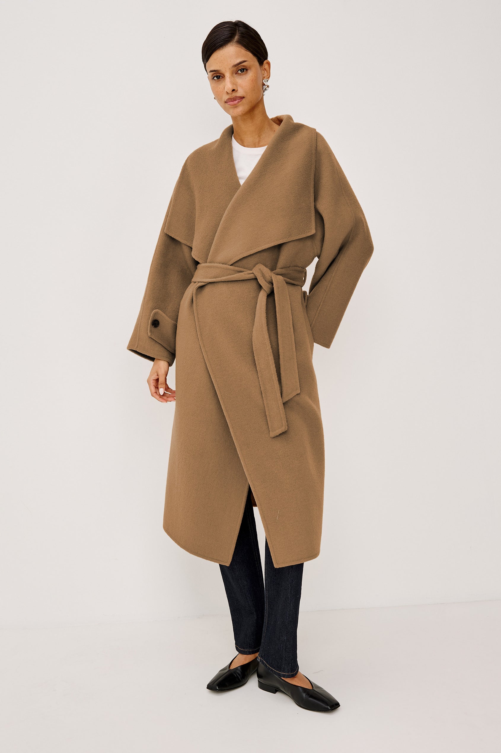 Celeste Coat in Heavy Wool Blend With Shawl Collar, Full Length, Self-Belted Waist, Side Pockets, Button-Tab Cuffs, and Half-Lined Interior in Camel Colorway - Full Body Front View Featured on Model
