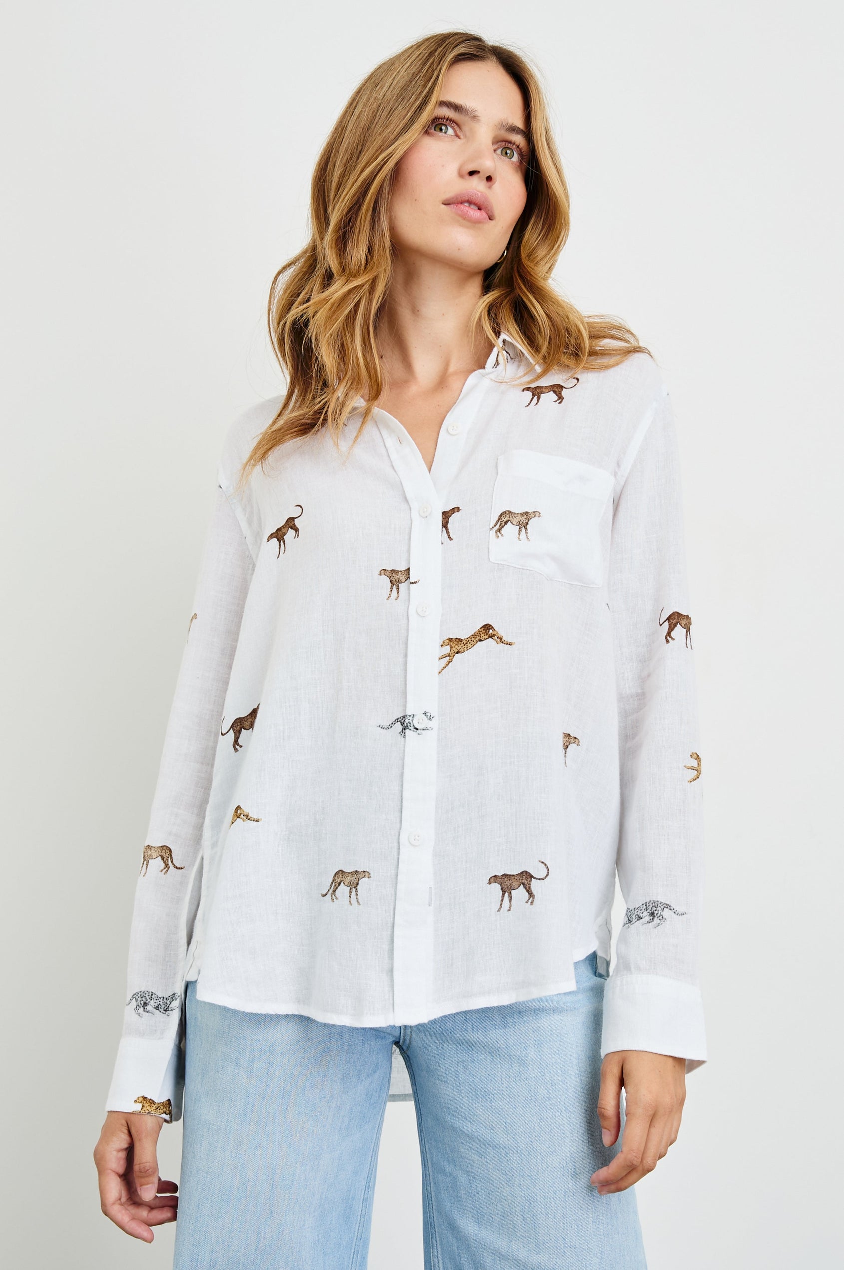 Charli Long-Sleeve Button up with a Chest Patch Pocket in Safari Cheetah Colorway, with cheetahs in browns and white on ivory - Front View Featured on Model