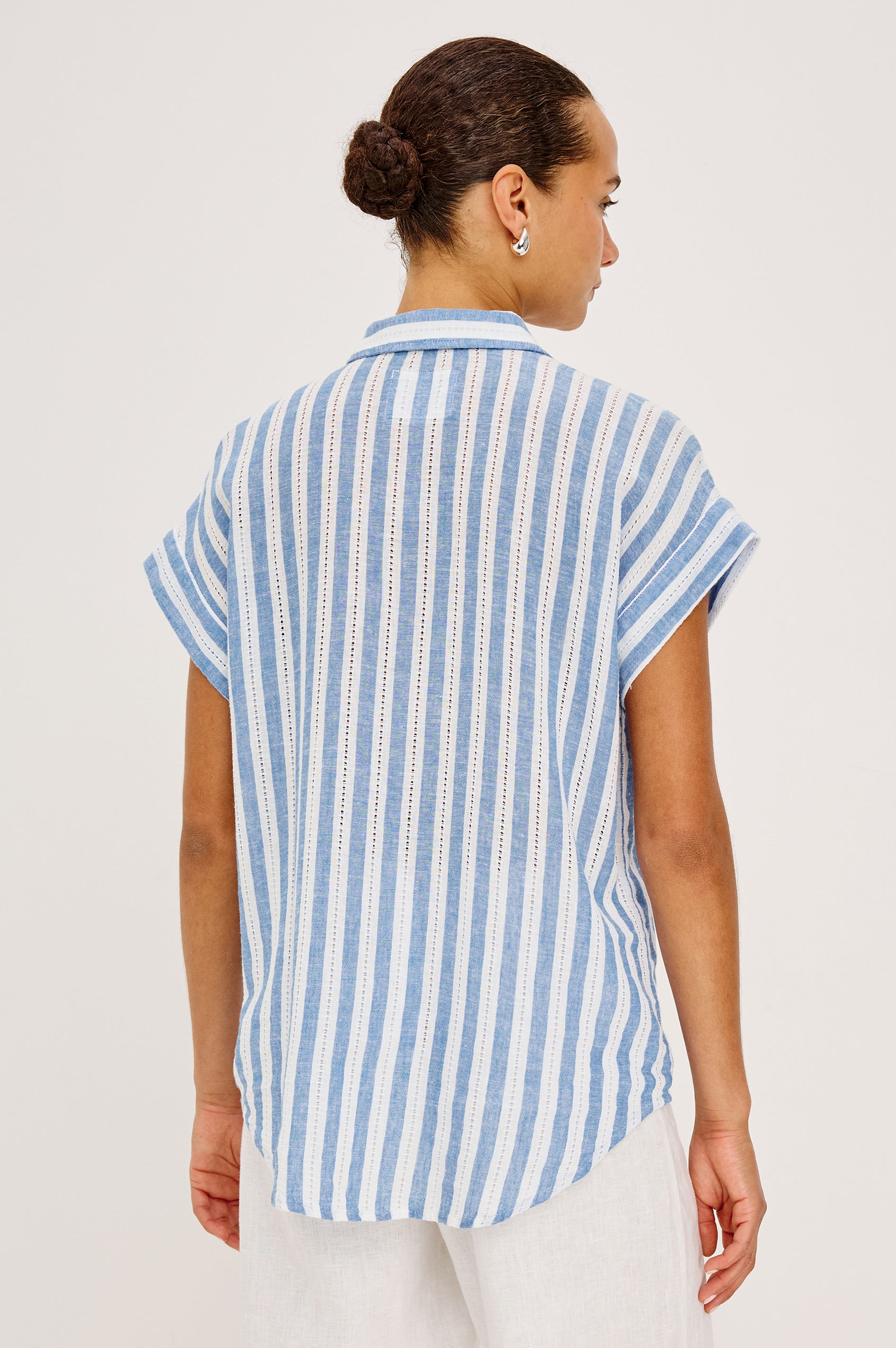 Cito Relaxed Button-Up Shirt in Luxe Linen With Collar, Chest Patch Pockets, and Cuffed Cap Sleeves in Atlantis Stripe Colorway - Upper Body Back View Featured on Model