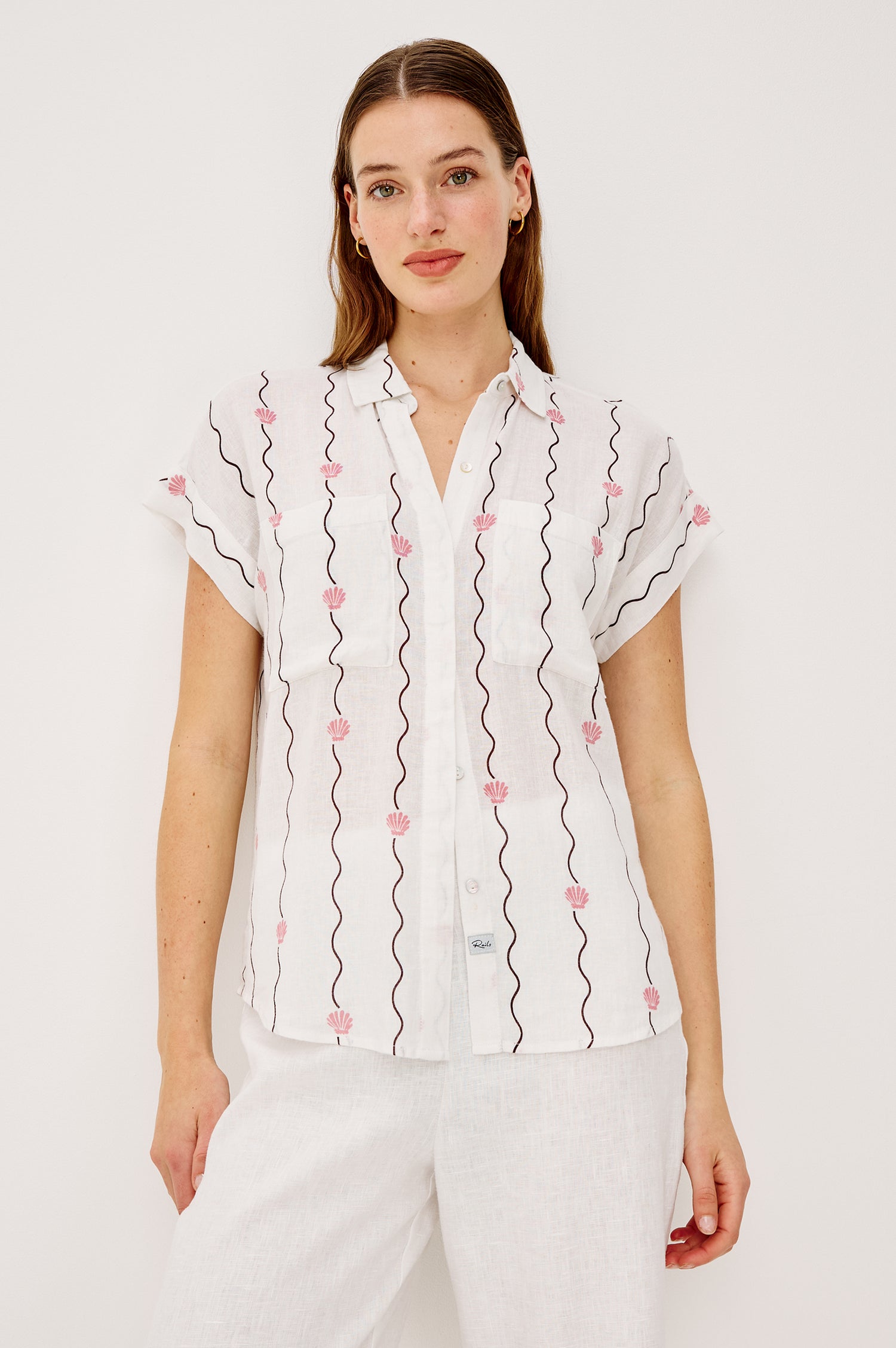 Cito Relaxed Button-Up Shirt in Linen With Collar Chest Patch Pockets and Cuffed Cap Sleeves in Striped Seashells Colorway - Upper Body Front View Featured on Model