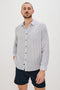 Connor Long-Sleeve Button Up with a Chest Patch Pocket in Denim White Railroad Colorway, Vertical Stripes - Front View Featured on Model