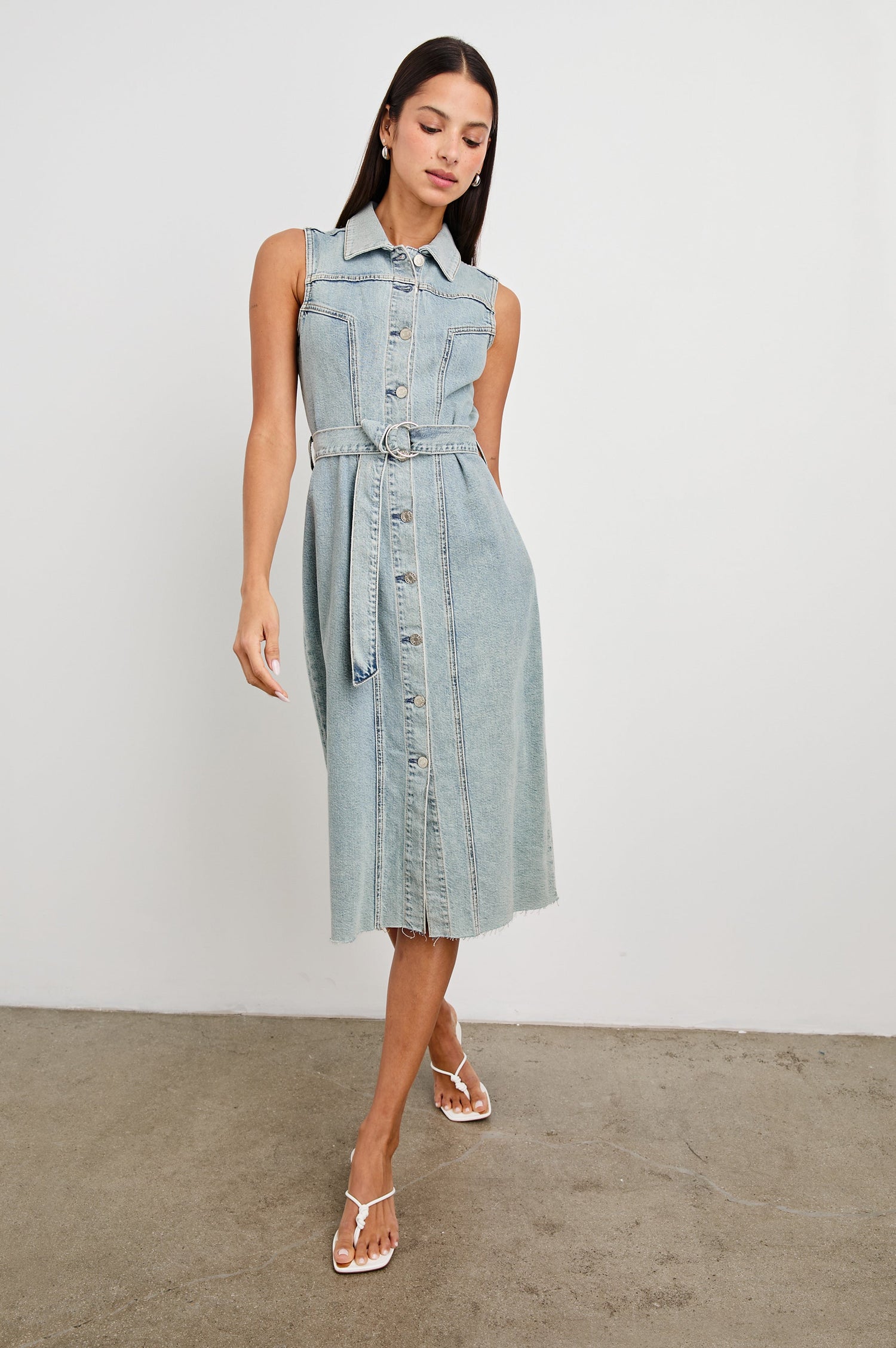 Costa form fitting, short sleeve denim midi dress with adjustable O-ring belt and front buttons in Low Tide - front view on model
